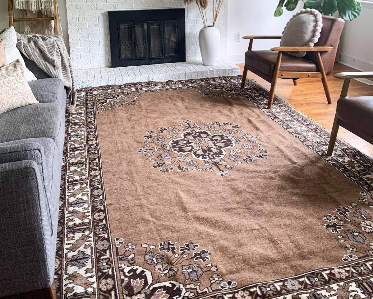 Vintage Persian Ferdos rug in a living room