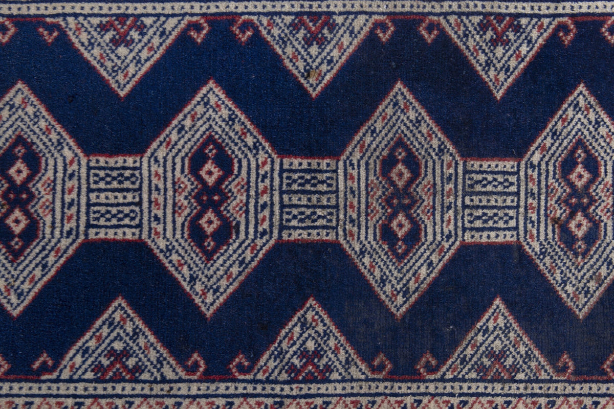 Persian Torkaman accent rug in navy and greige, view 7 of 10