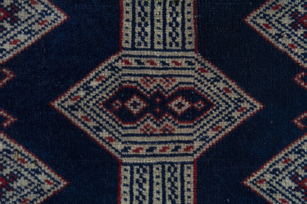 Persian Torkaman accent rug in navy and greige, view 7 of 9