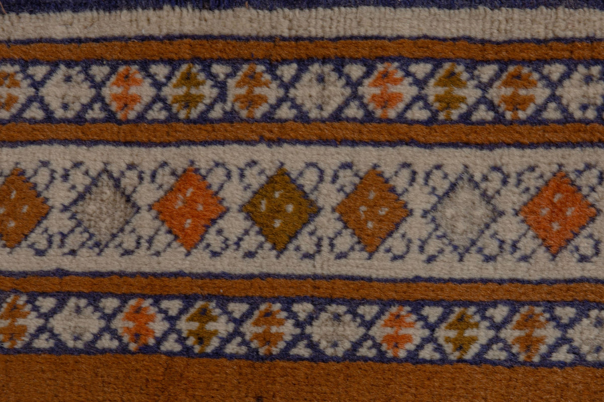 Persian Baluch accent rug in rust and blue, view 7 of 8