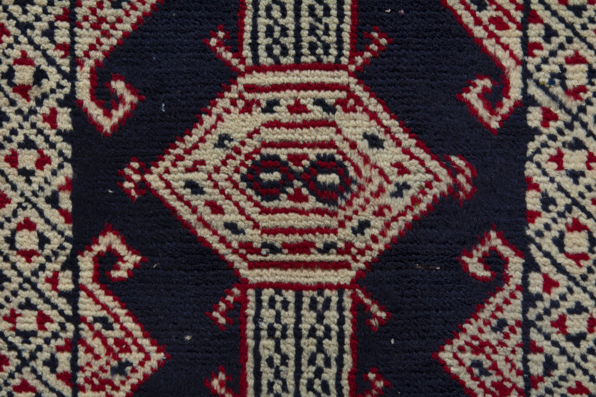 Persian Torkaman accent rug in navy and cream, view 7 of 9
