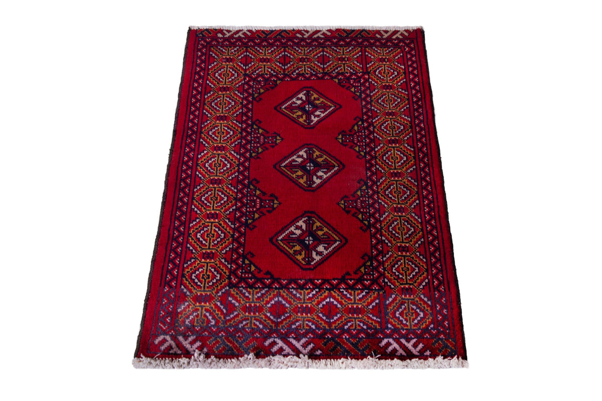 Persian Torkaman accent rug in deep red and navy, view 3 of 9