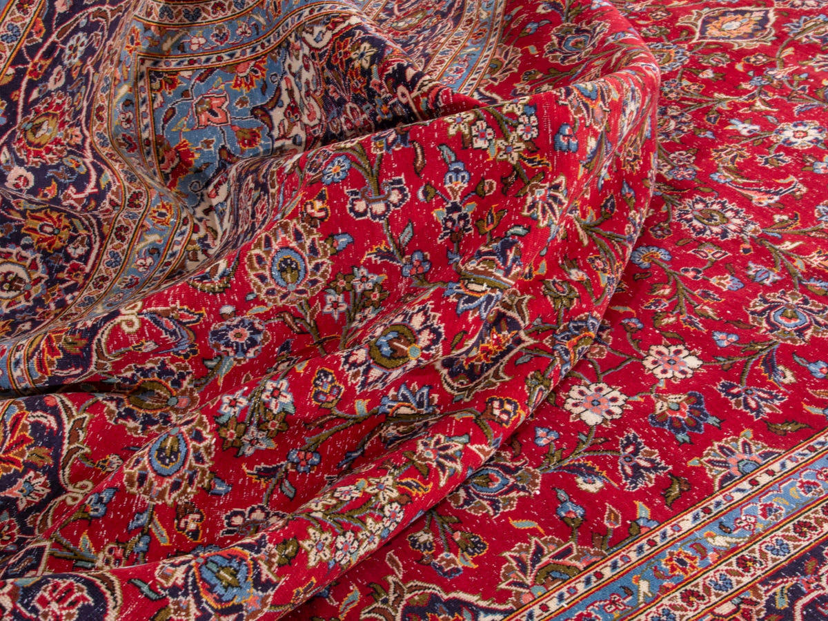 Persian Kashan oversized rug in deep red and navy, view 17 of 20
