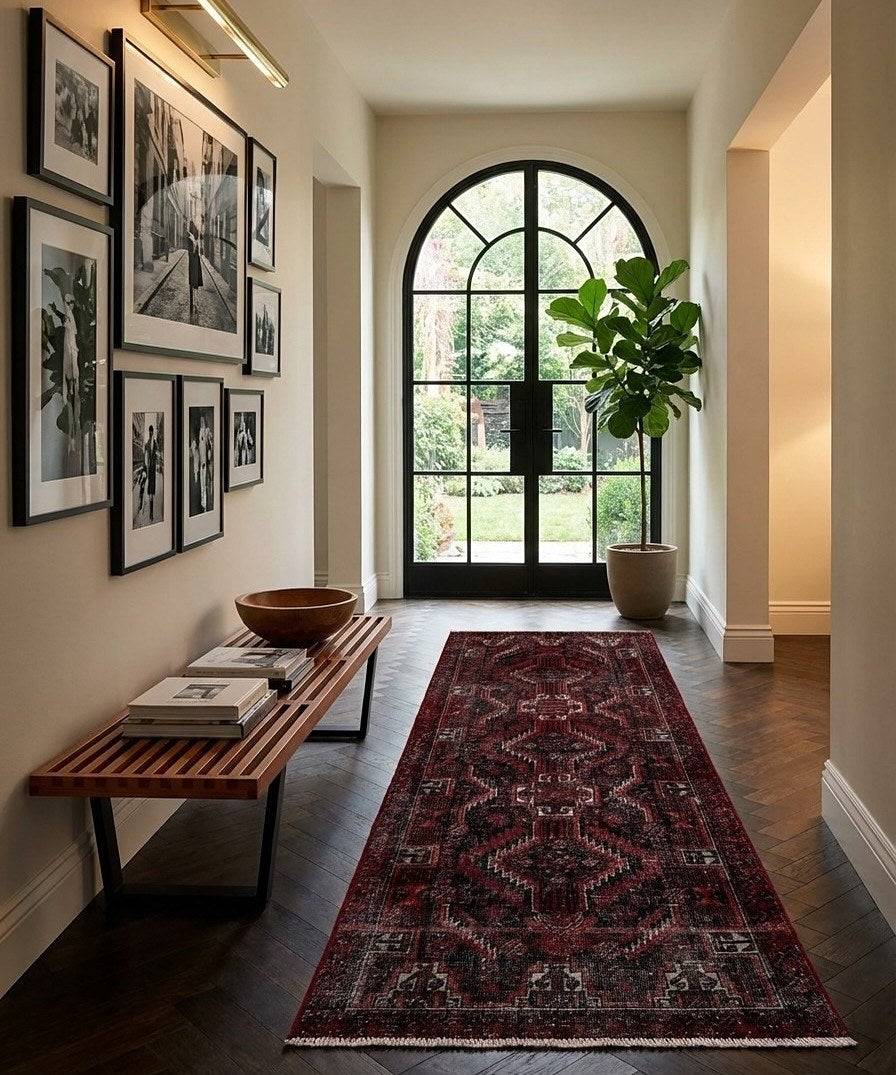 A vintage Hamadan runner laid down a hallway