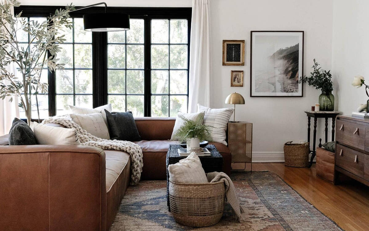 Vintage Persian rug in a living room with a leather sofa