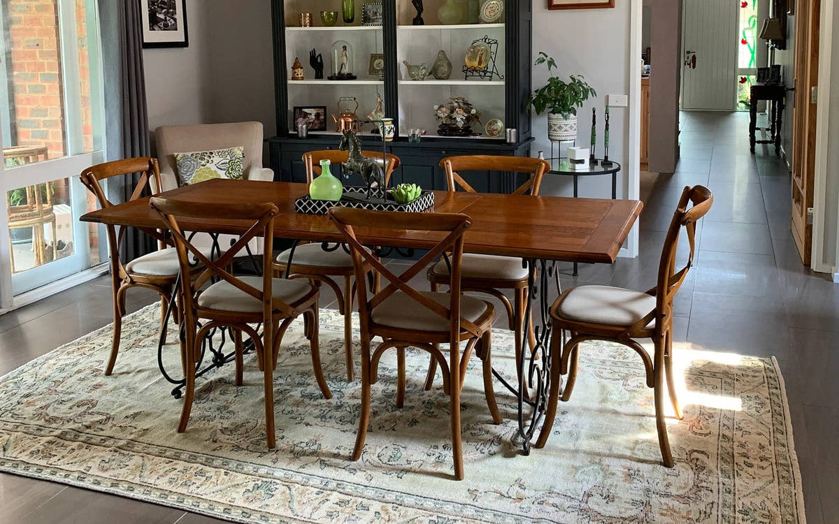 Vintage rug under a wooden dining table