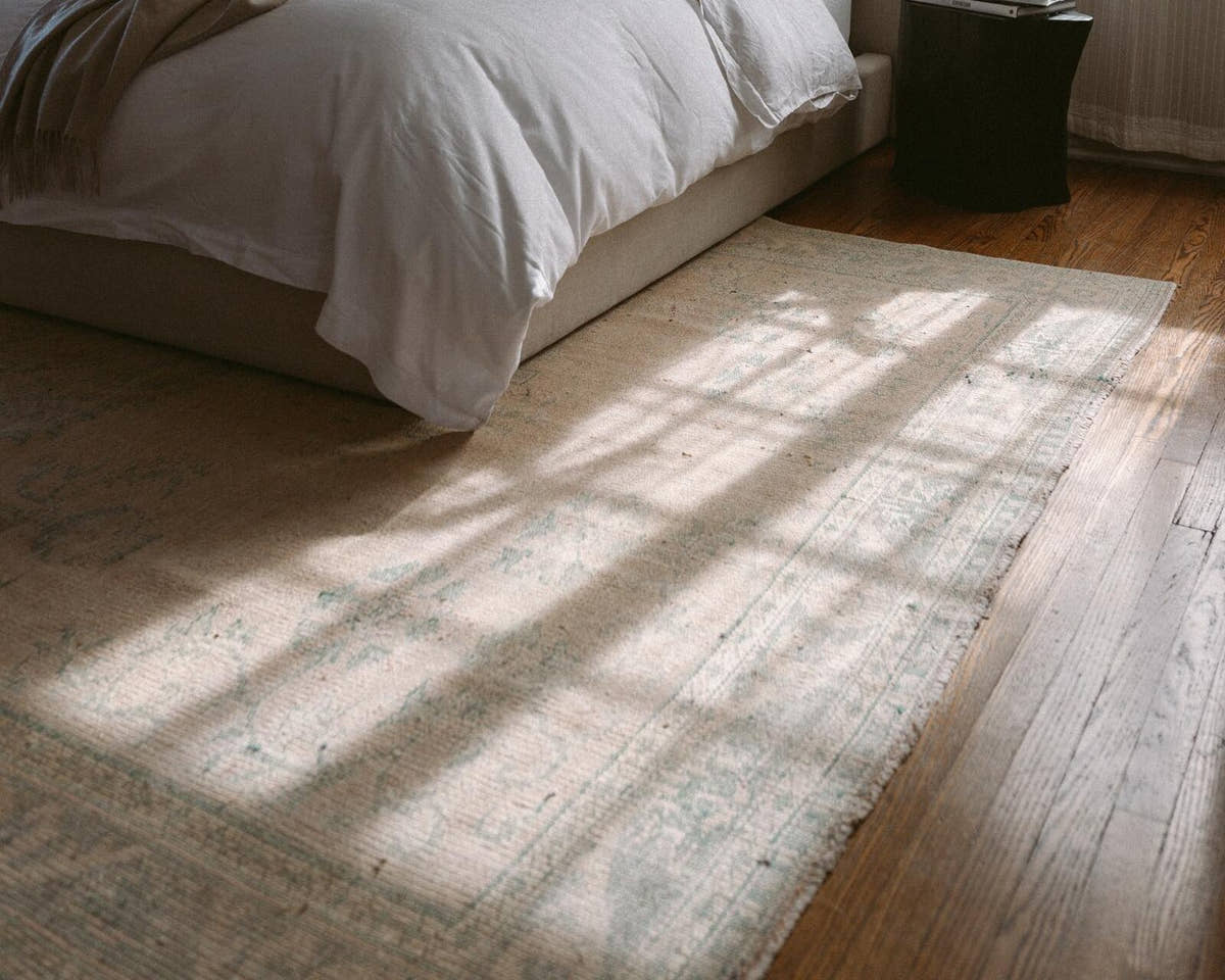 Vintage Turkish Manisa rug in a bedroom