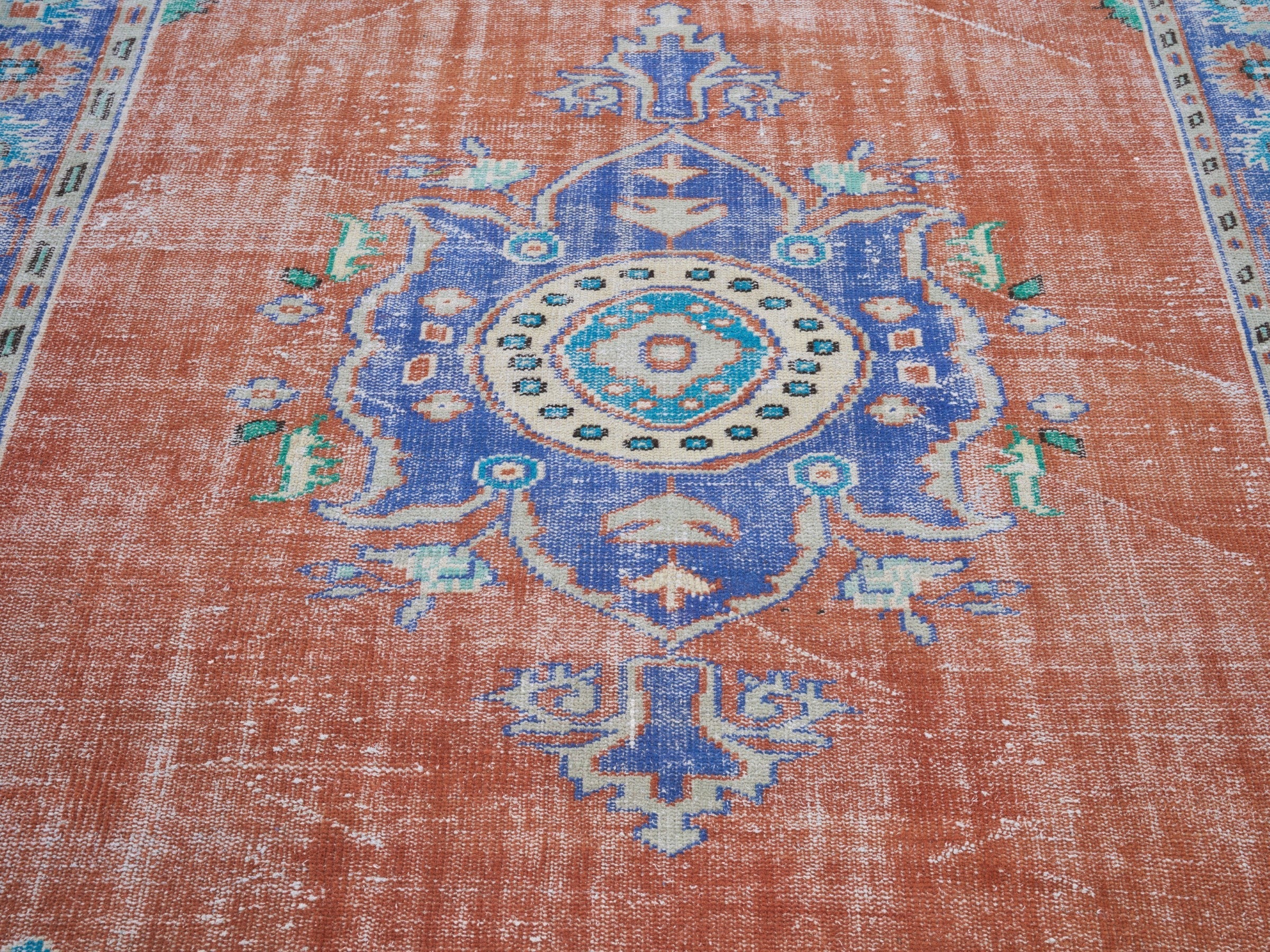 Turkish Manisa area rug in rust and navy, view 4 of 10