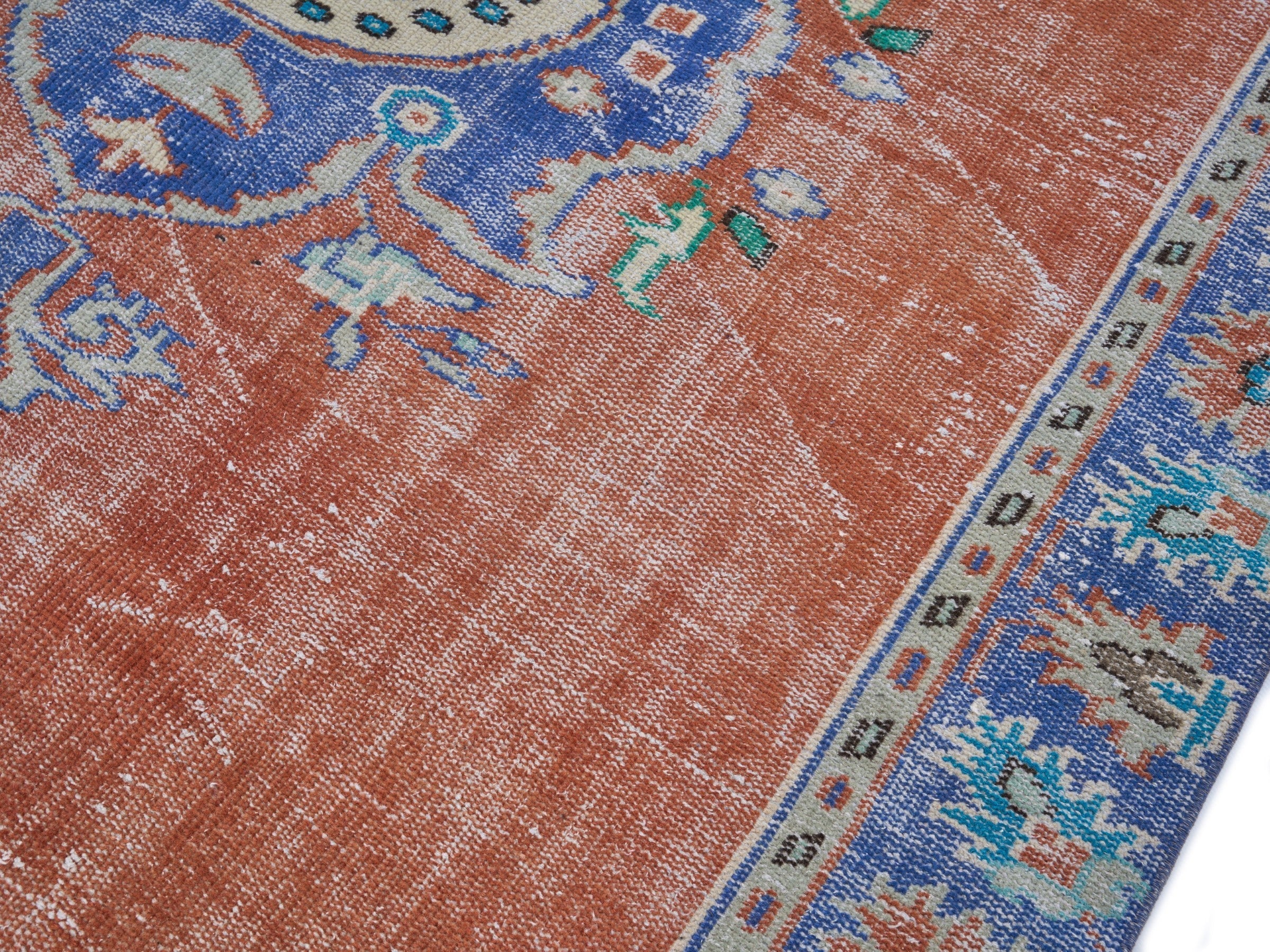 Turkish Manisa area rug in rust and navy, view 5 of 10