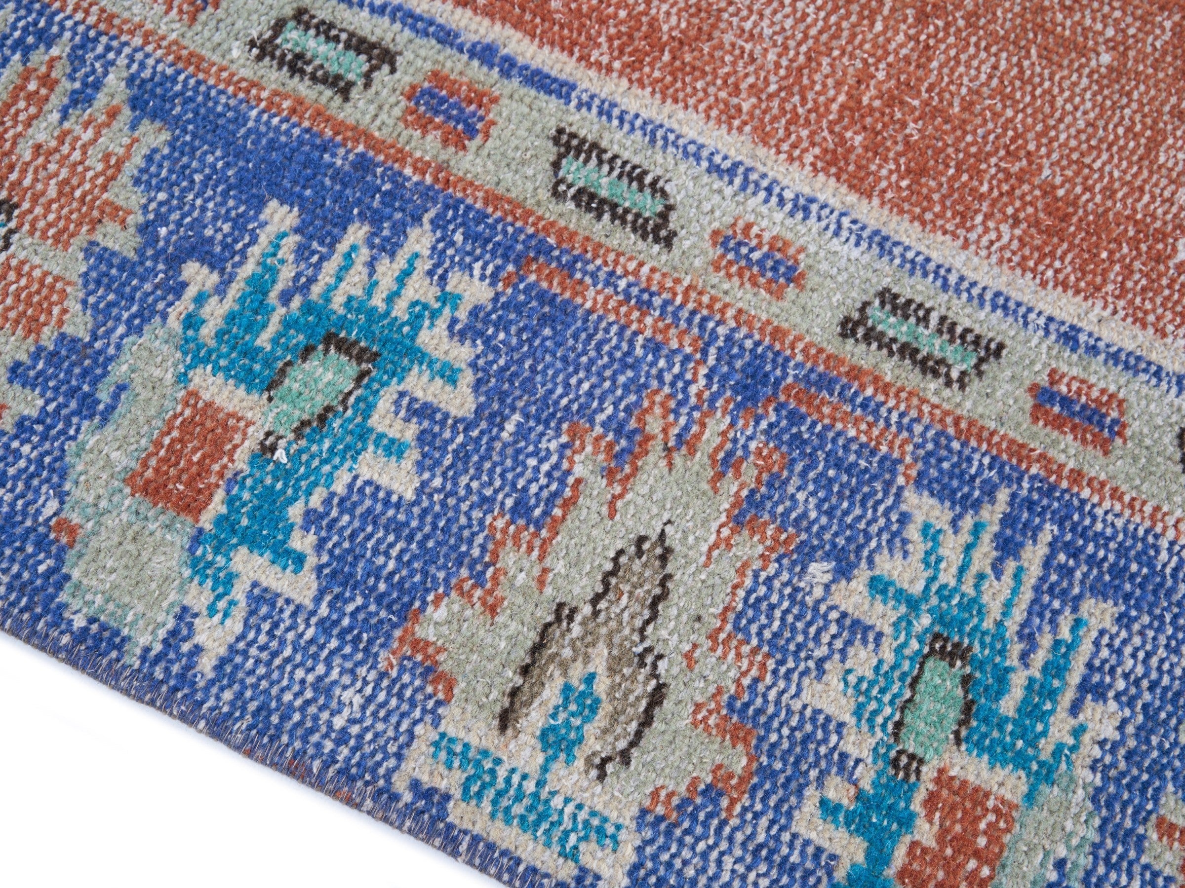 Turkish Manisa area rug in rust and navy, view 6 of 10