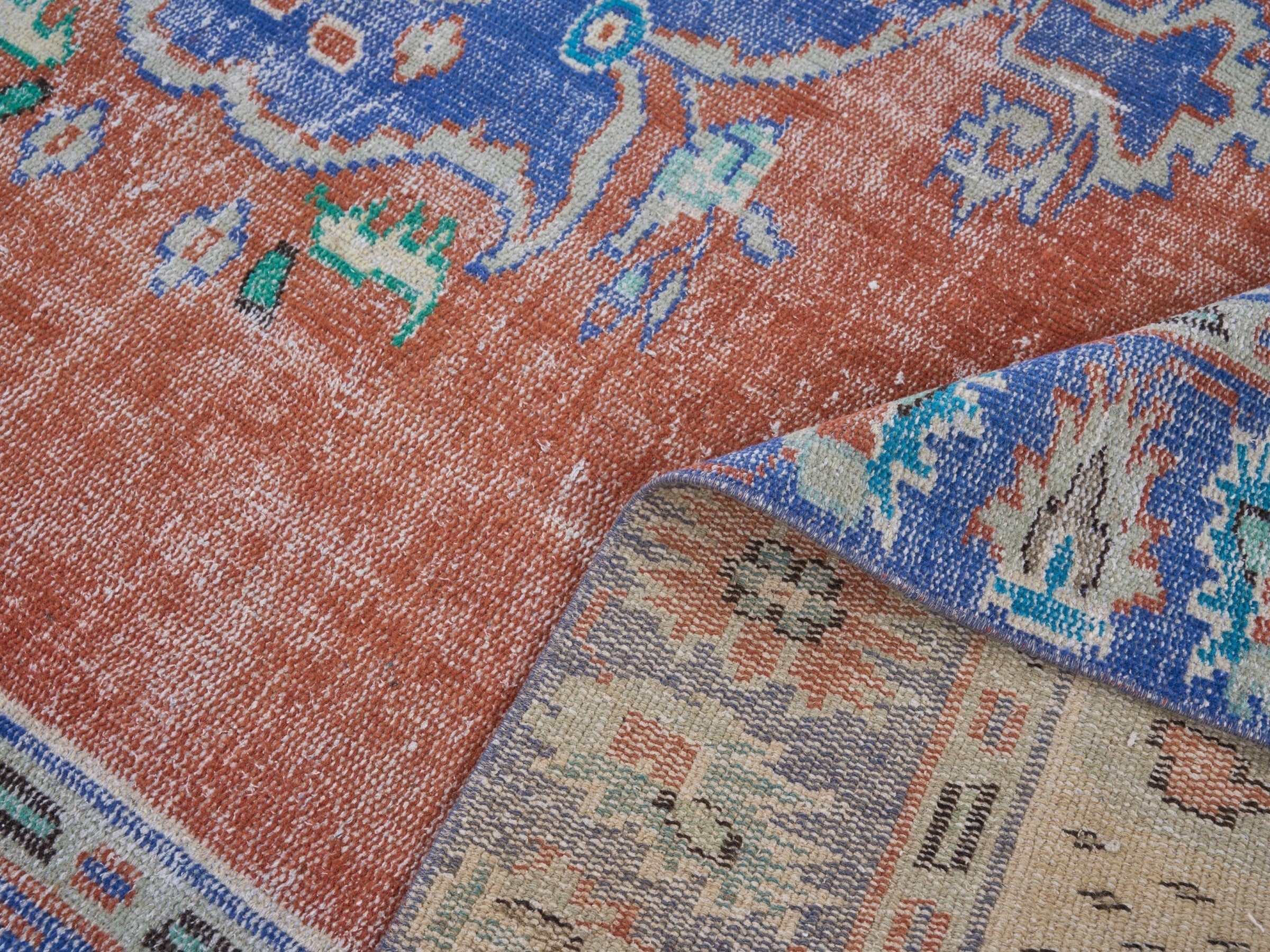 Turkish Manisa area rug in rust and navy, view 9 of 10
