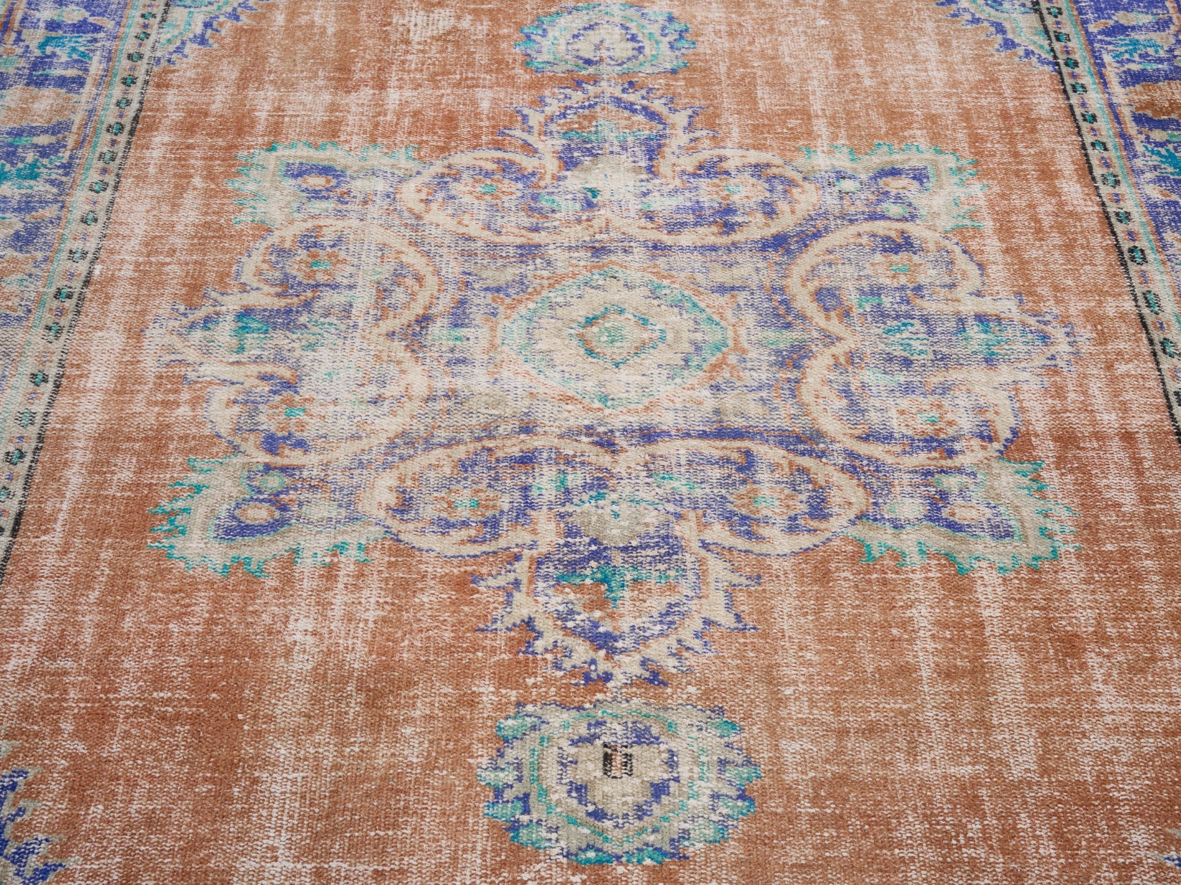 Turkish Manisa area rug in terracotta and navy, view 4 of 10