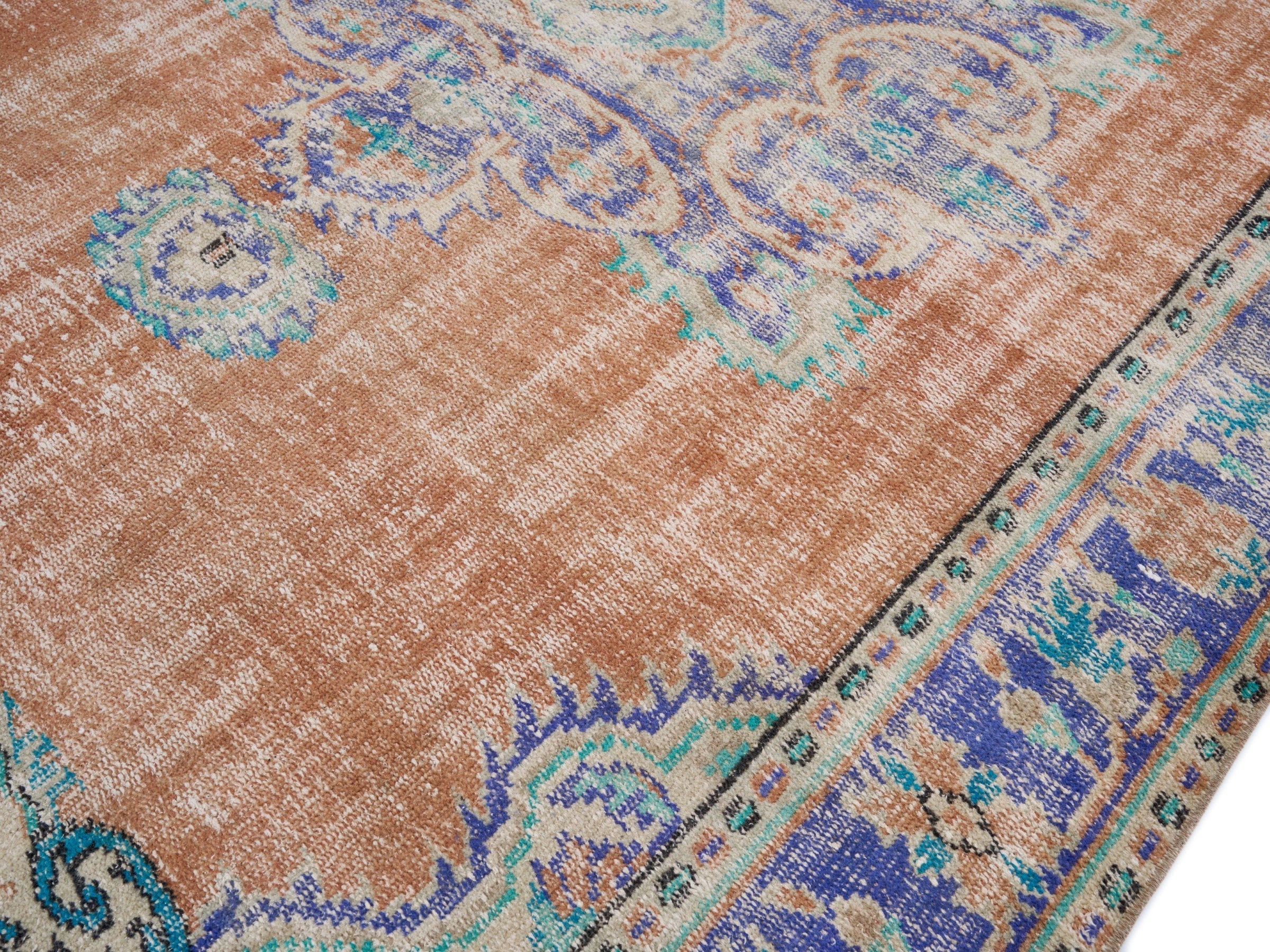 Turkish Manisa area rug in terracotta and navy, view 5 of 10