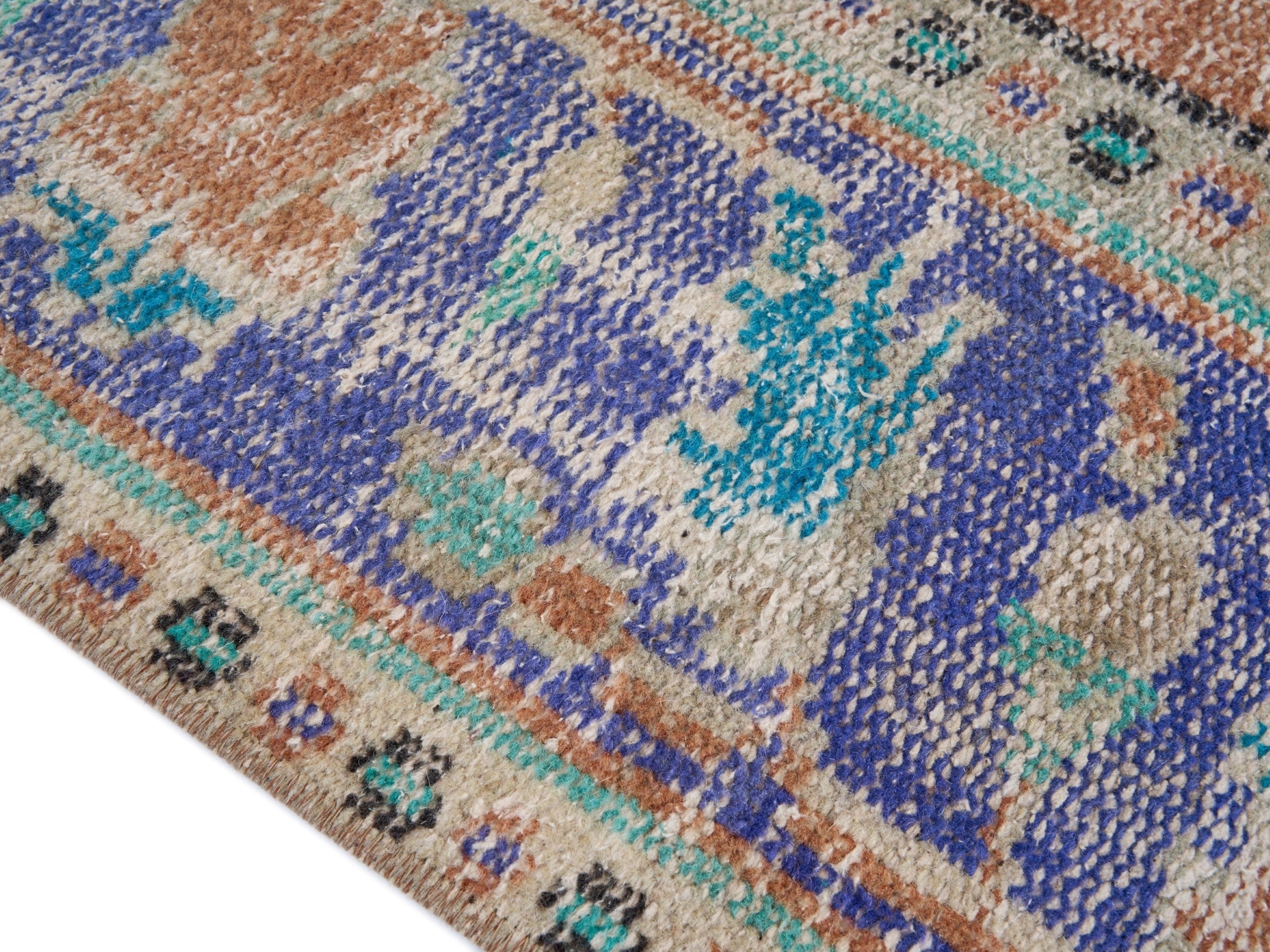 Turkish Manisa area rug in terracotta and navy, view 6 of 10