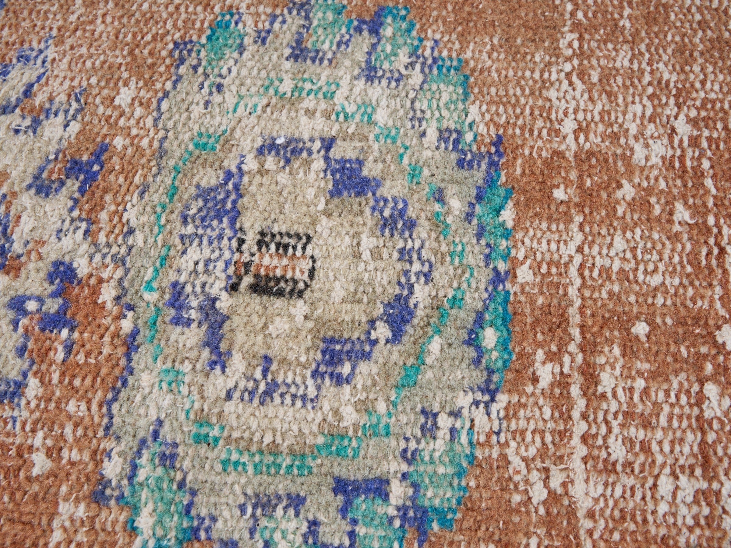 Turkish Manisa area rug in terracotta and navy, view 7 of 10