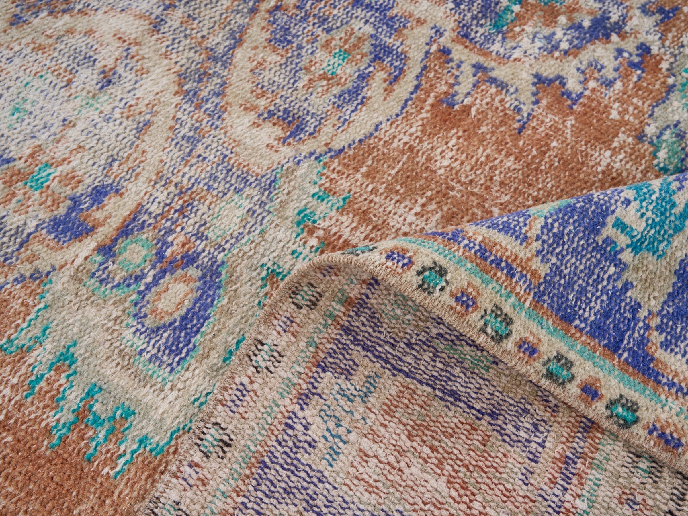 Turkish Manisa area rug in terracotta and navy, view 9 of 10
