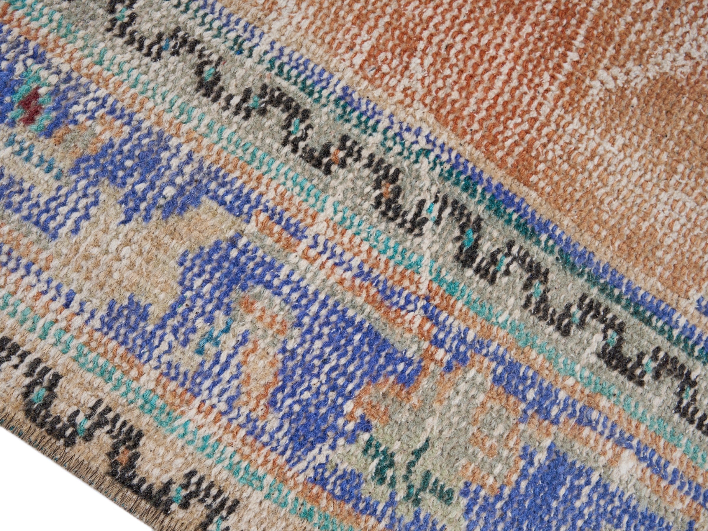 Turkish Manisa area rug in terracotta and blue, view 6 of 10