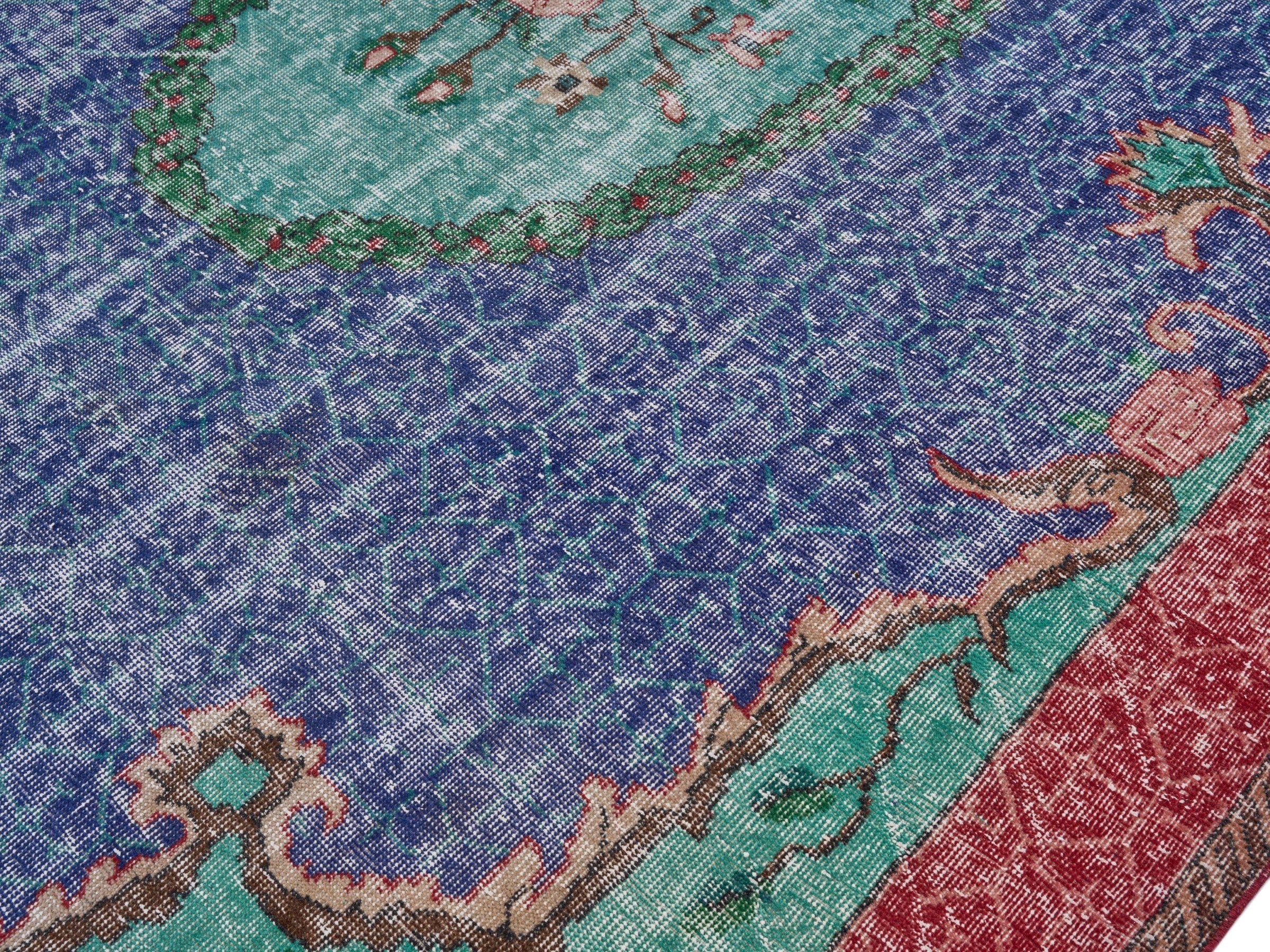 Turkish Isparta area rug in deep indigo and rose, view 5 of 10