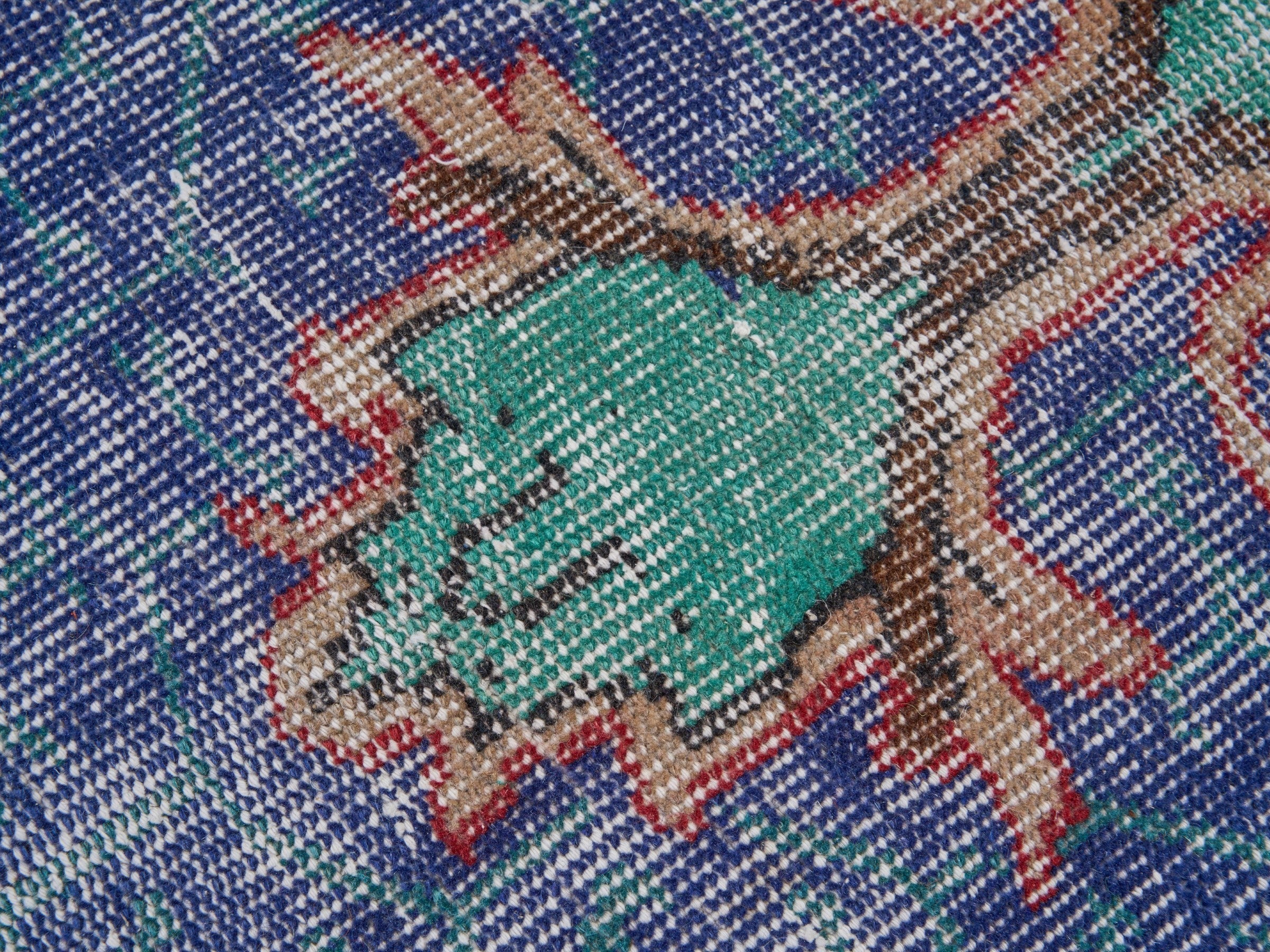 Turkish Isparta area rug in deep indigo and rose, view 7 of 10