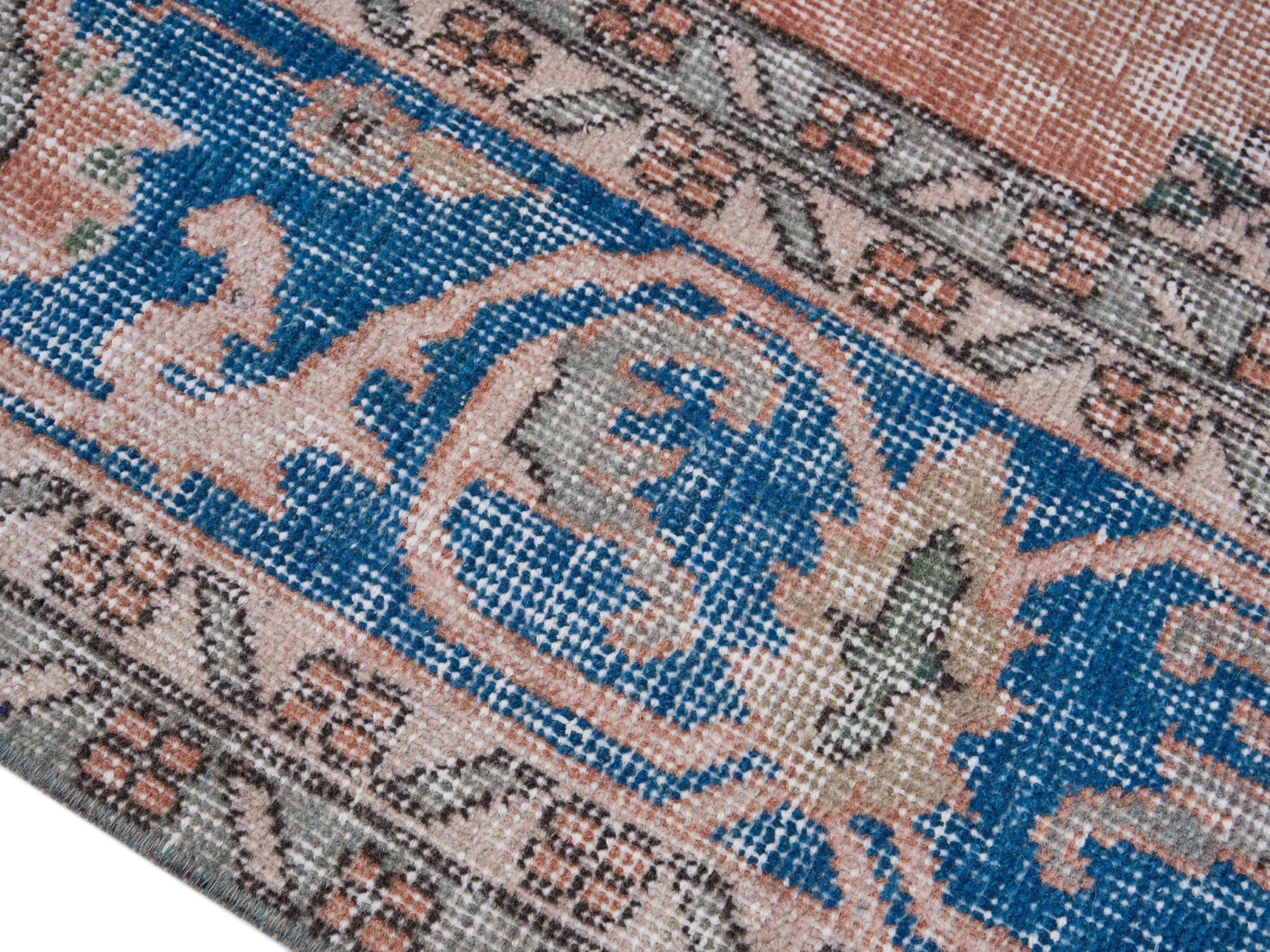 Turkish Isparta area rug in terracotta and navy, view 6 of 10