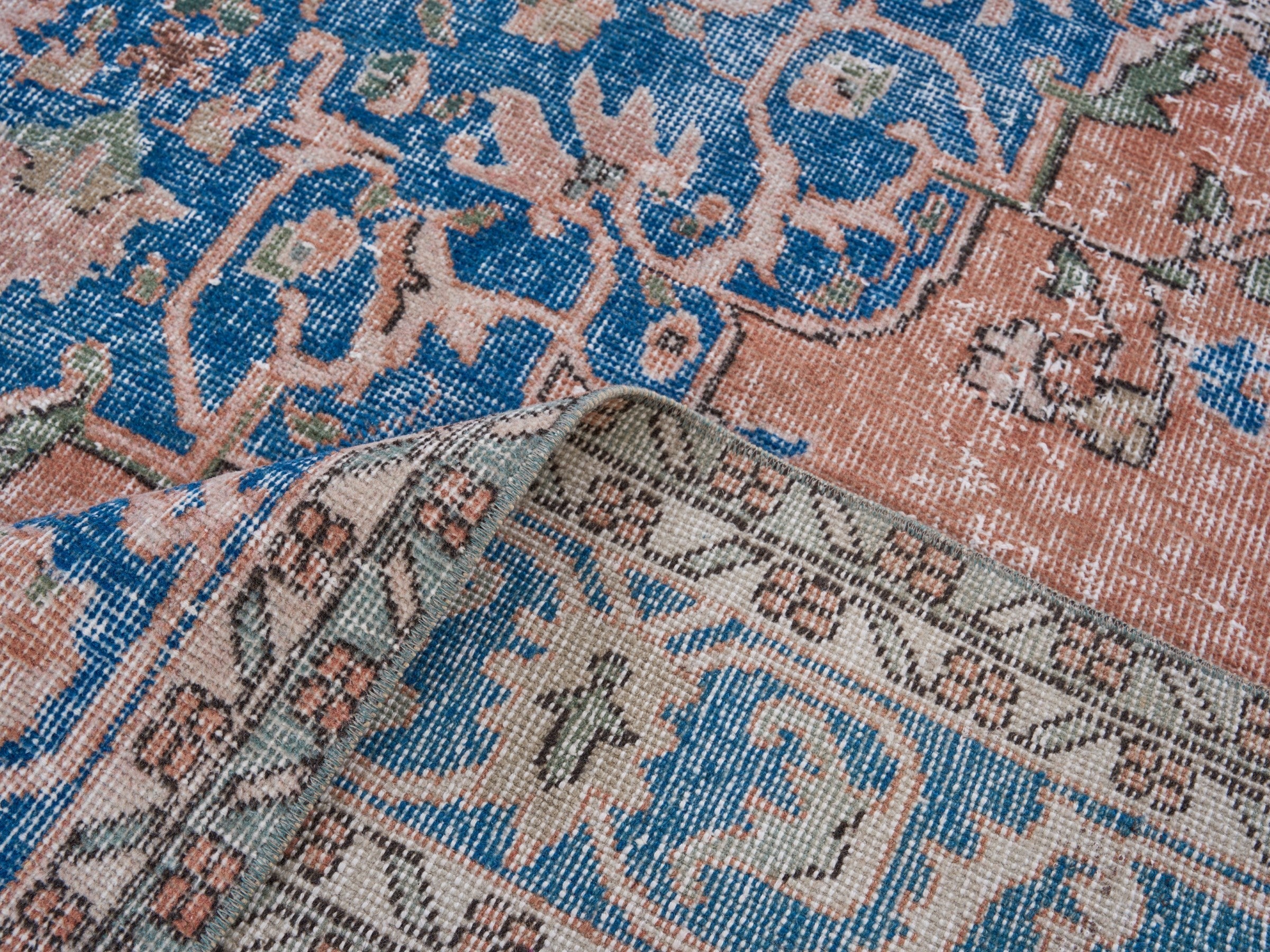 Turkish Isparta area rug in terracotta and navy, view 9 of 10