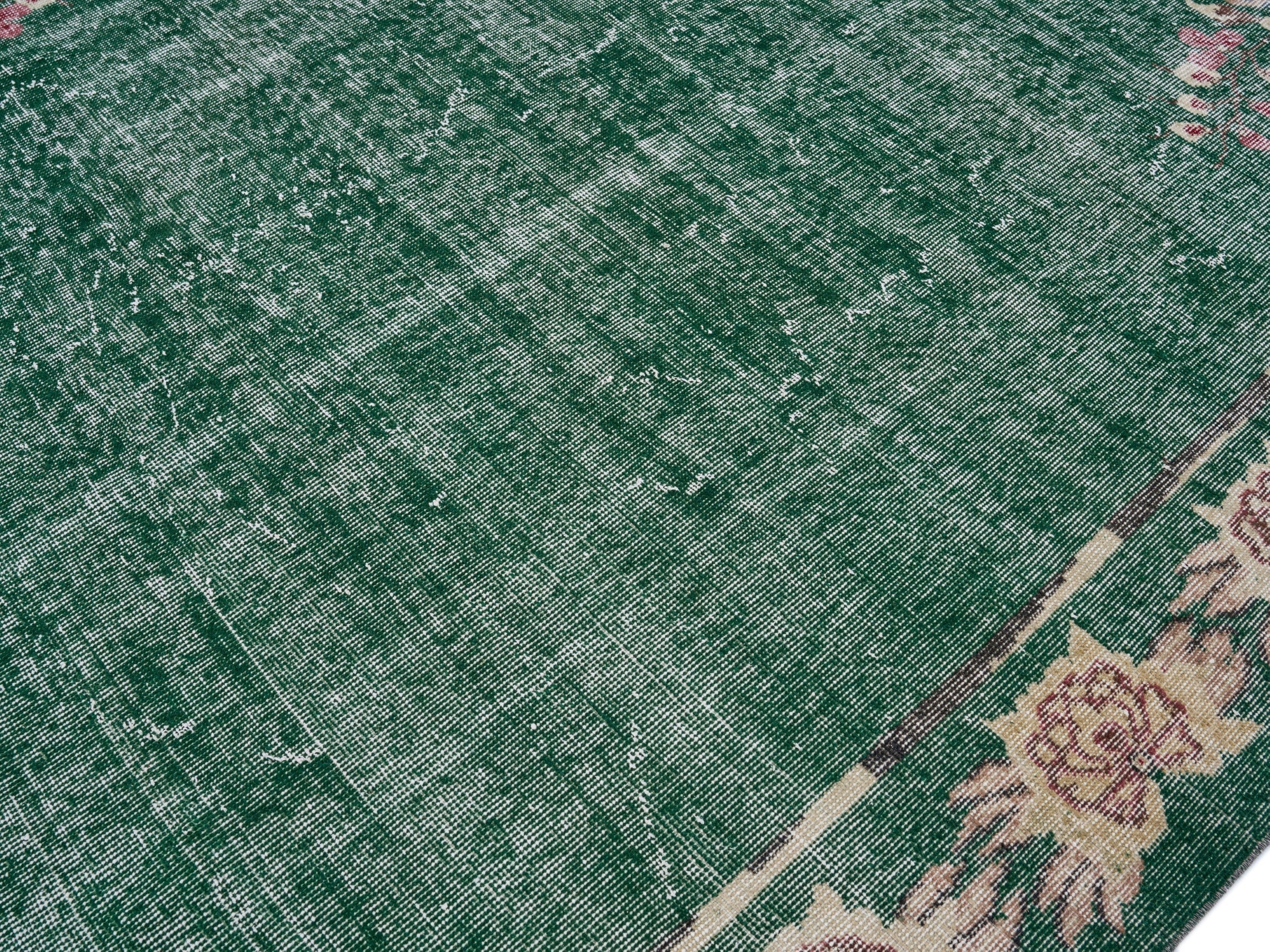 Turkish Isparta area rug in forest and muted pink, view 5 of 10