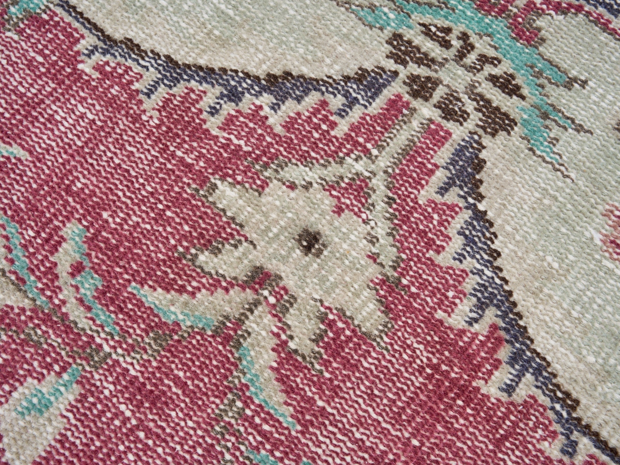 Turkish Manisa area rug in faded red and cream, view 7 of 10