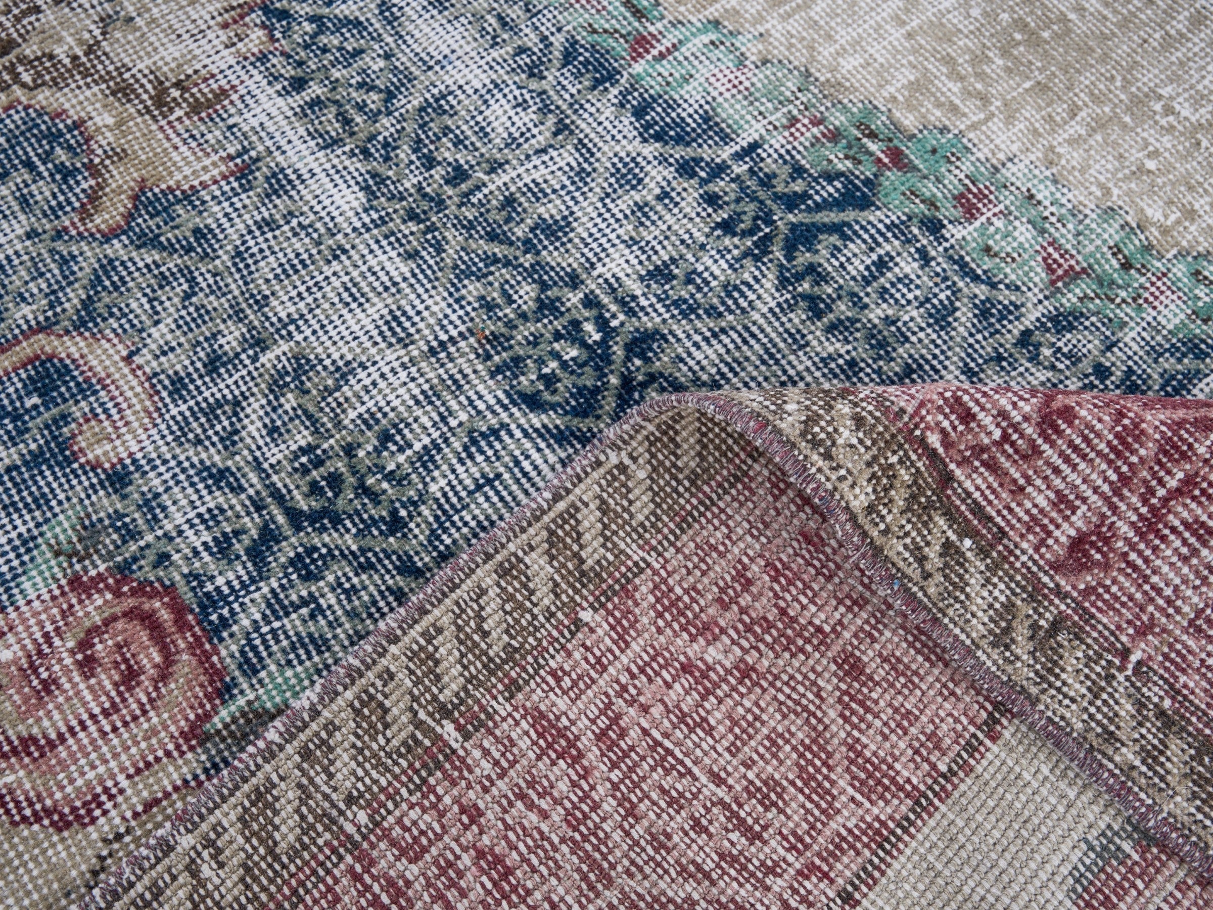 Turkish Isparta area rug in dark blue and burgundy, view 9 of 10