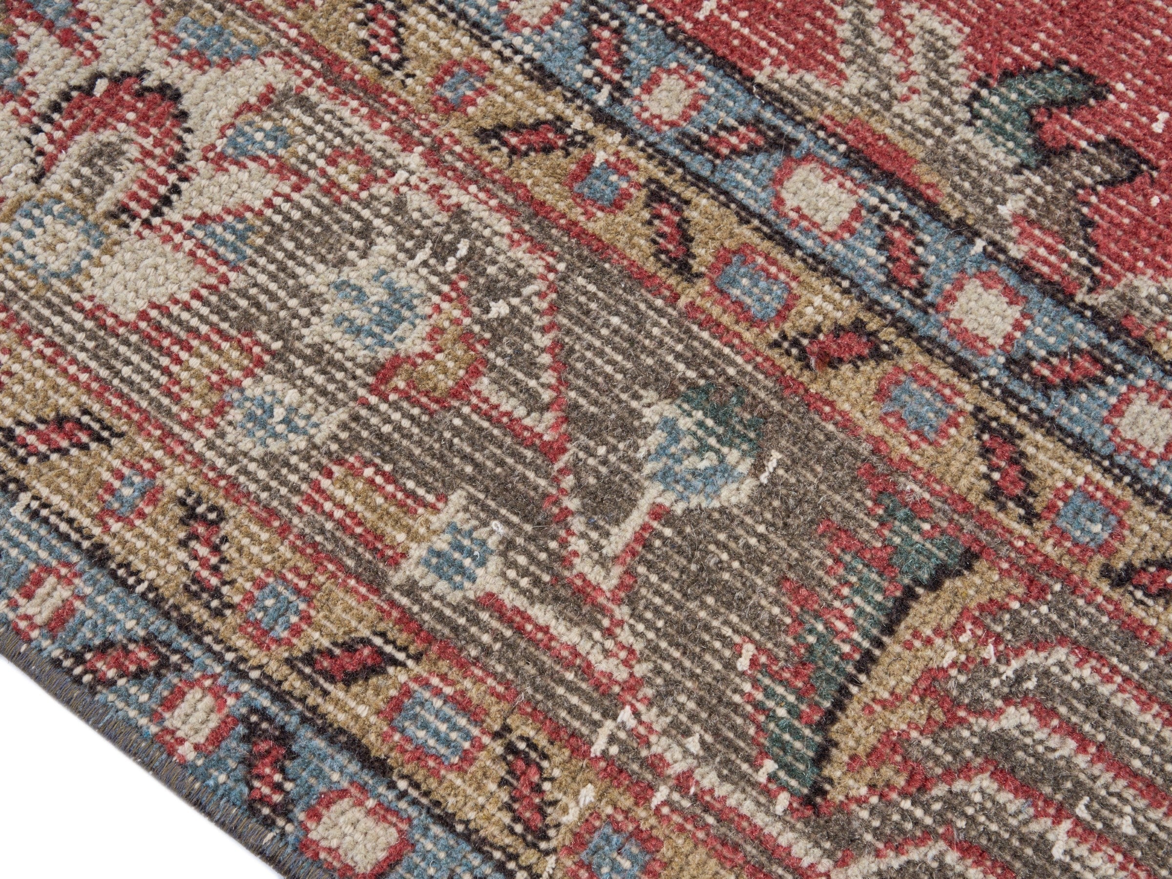 Turkish Isparta area rug in faded red and tan, view 6 of 10