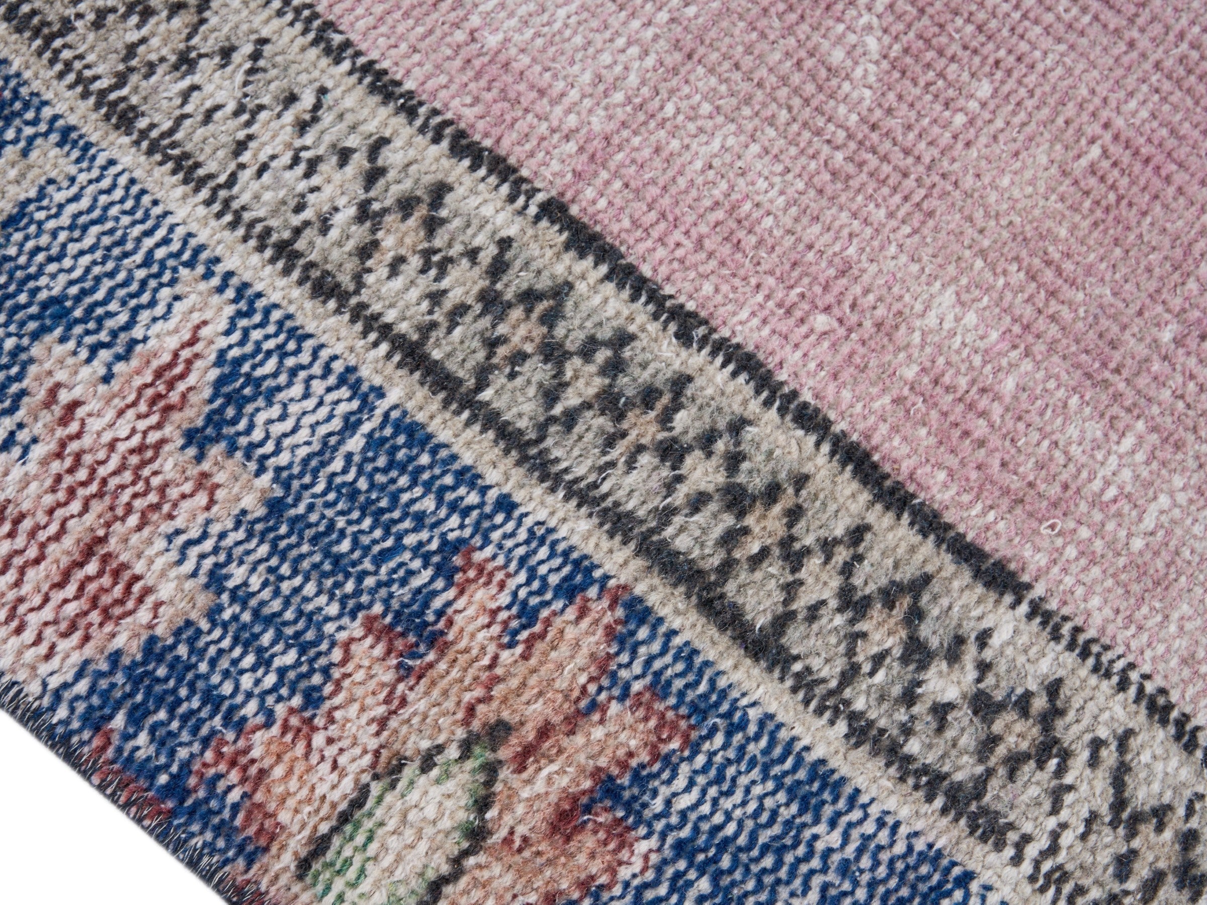 Turkish Manisa area rug in dusty rose and dark blue, view 6 of 10