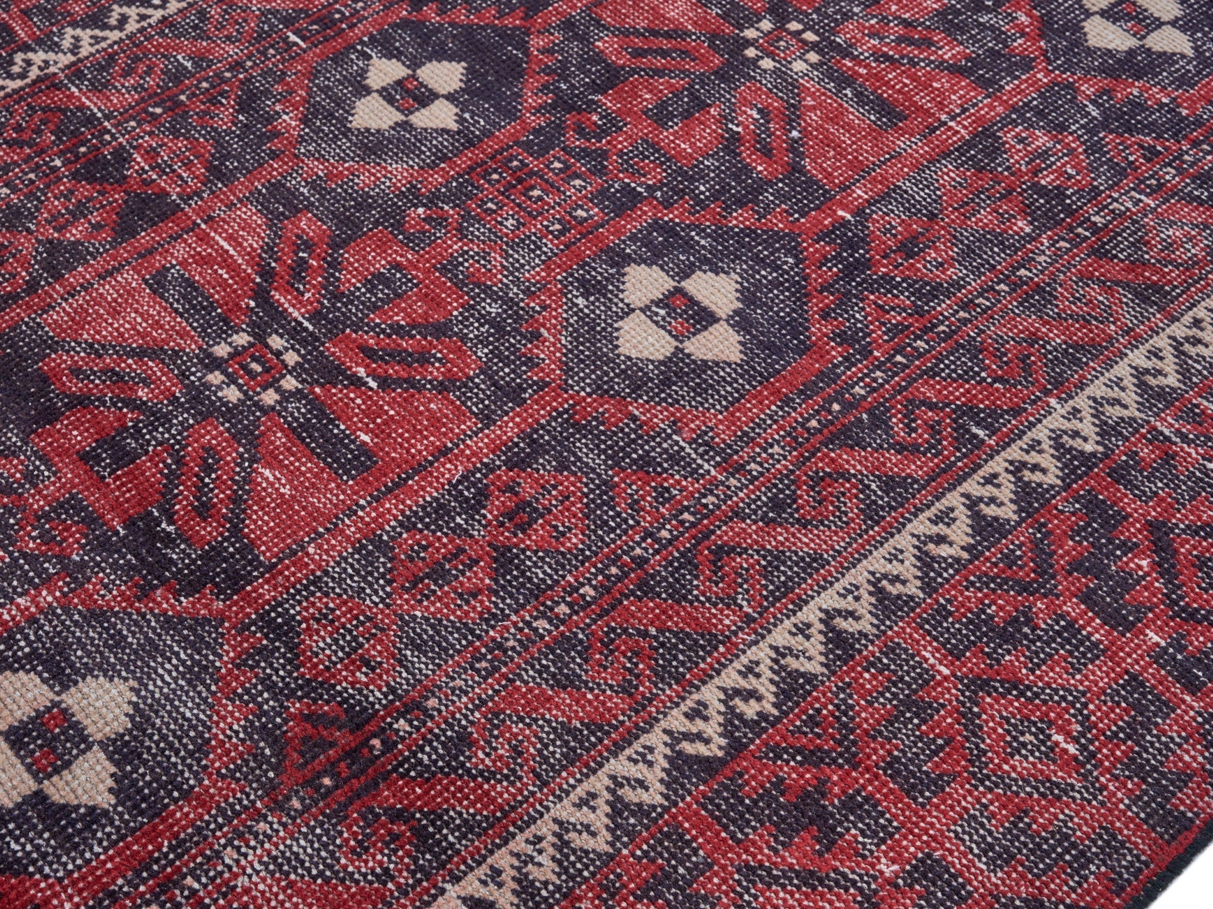 Persian Baluch area rug in burgundy and faded red, view 5 of 10