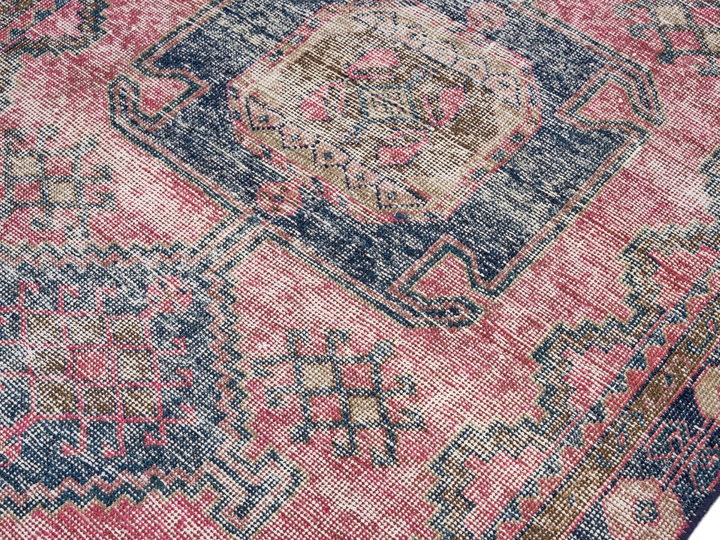 Persian Lori area rug in dusty rose and dark teal, view 5 of 10