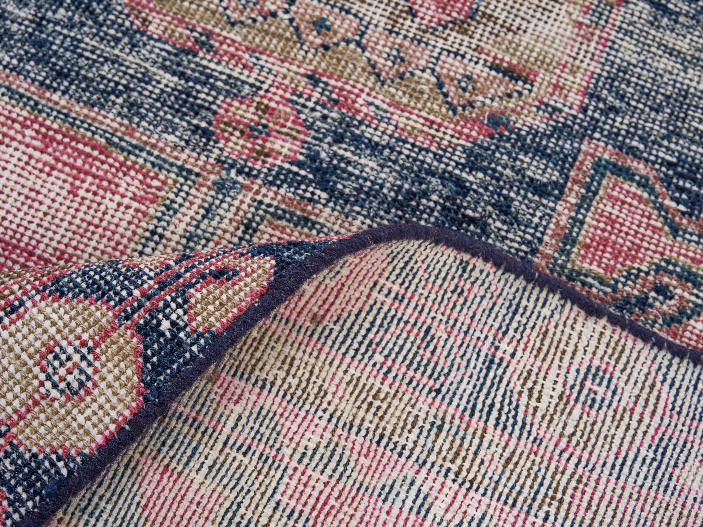 Persian Lori area rug in dusty rose and dark teal, view 9 of 10