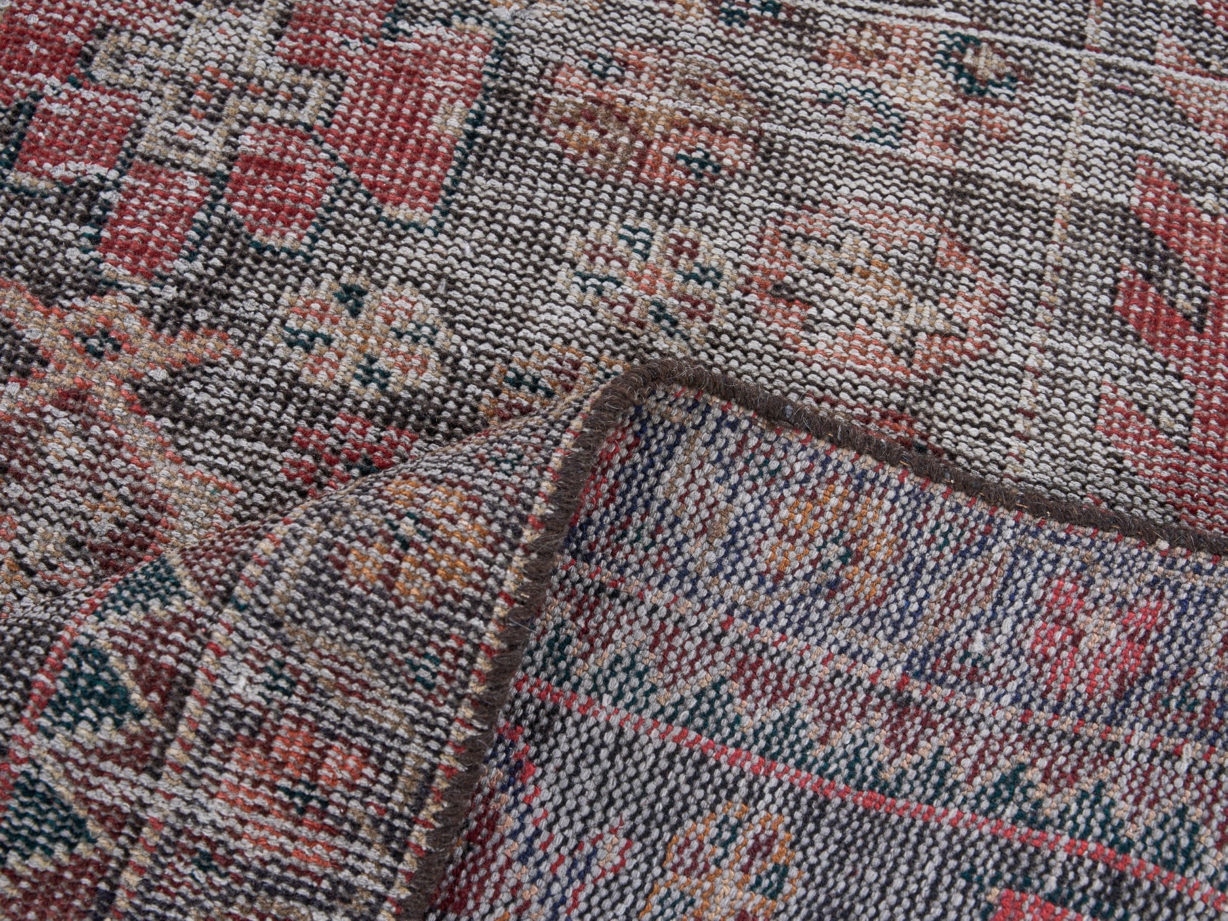 Persian Saveh runner rug in faded red and charcoal, view 9 of 10