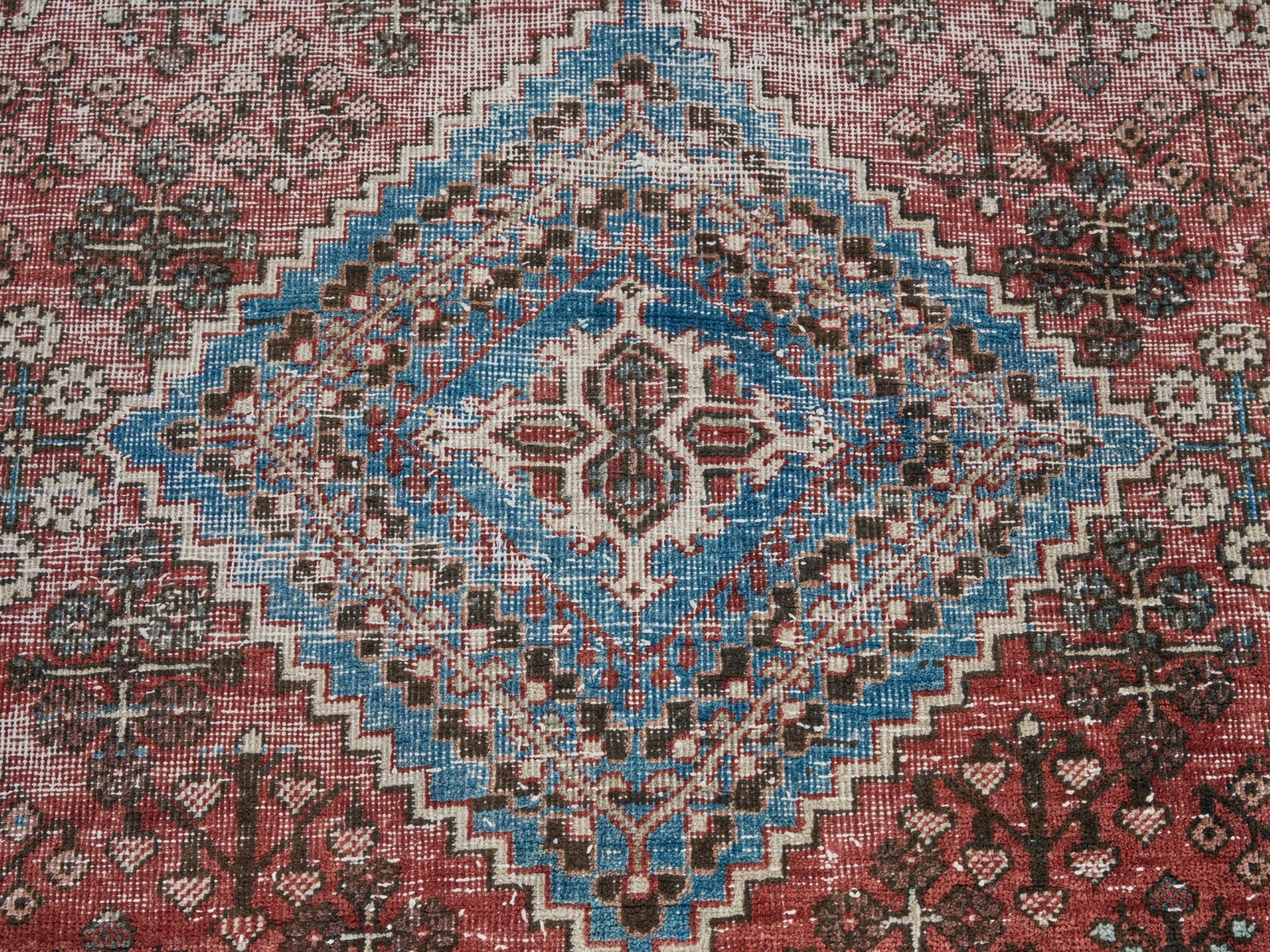 Persian Joshaghan accent rug in brick and denim, view 4 of 9
