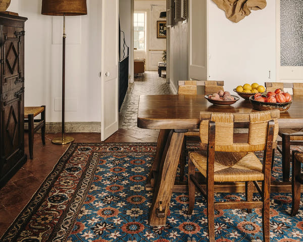 Oversized vintage Persian rug in a dining room