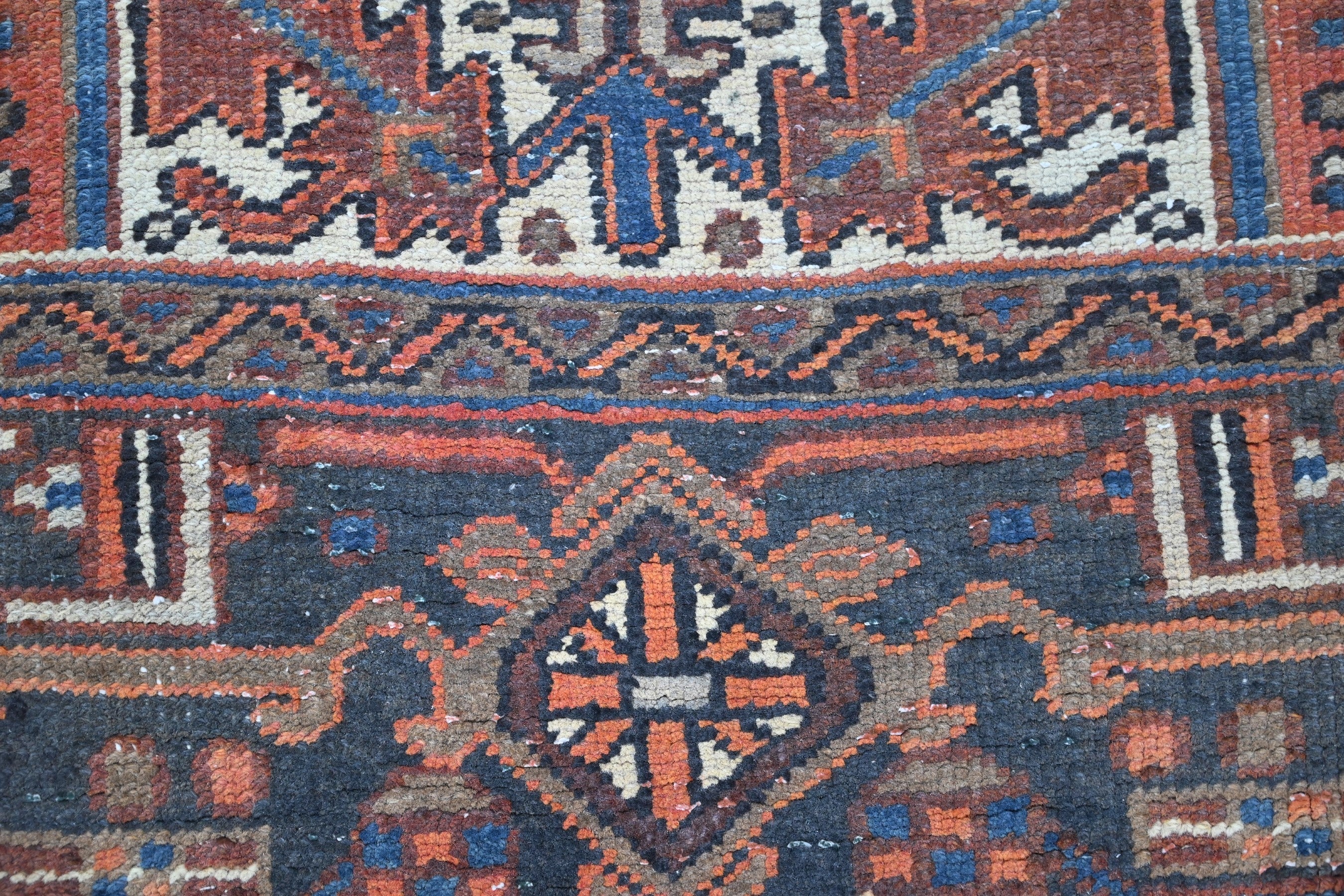 Persian Heriz area rug in rust and navy, view 10 of 21