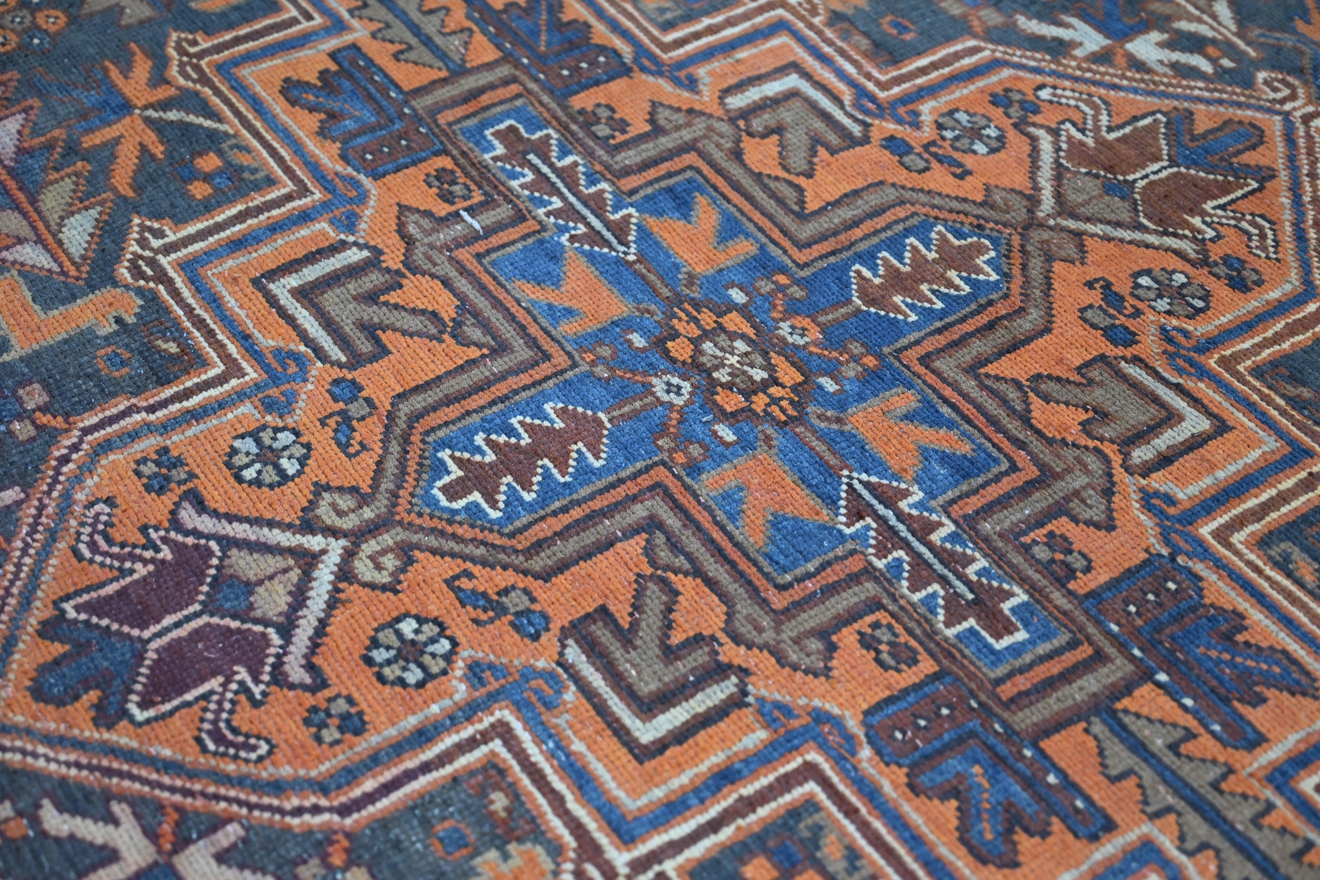 Persian Heriz area rug in rust and navy, view 13 of 21