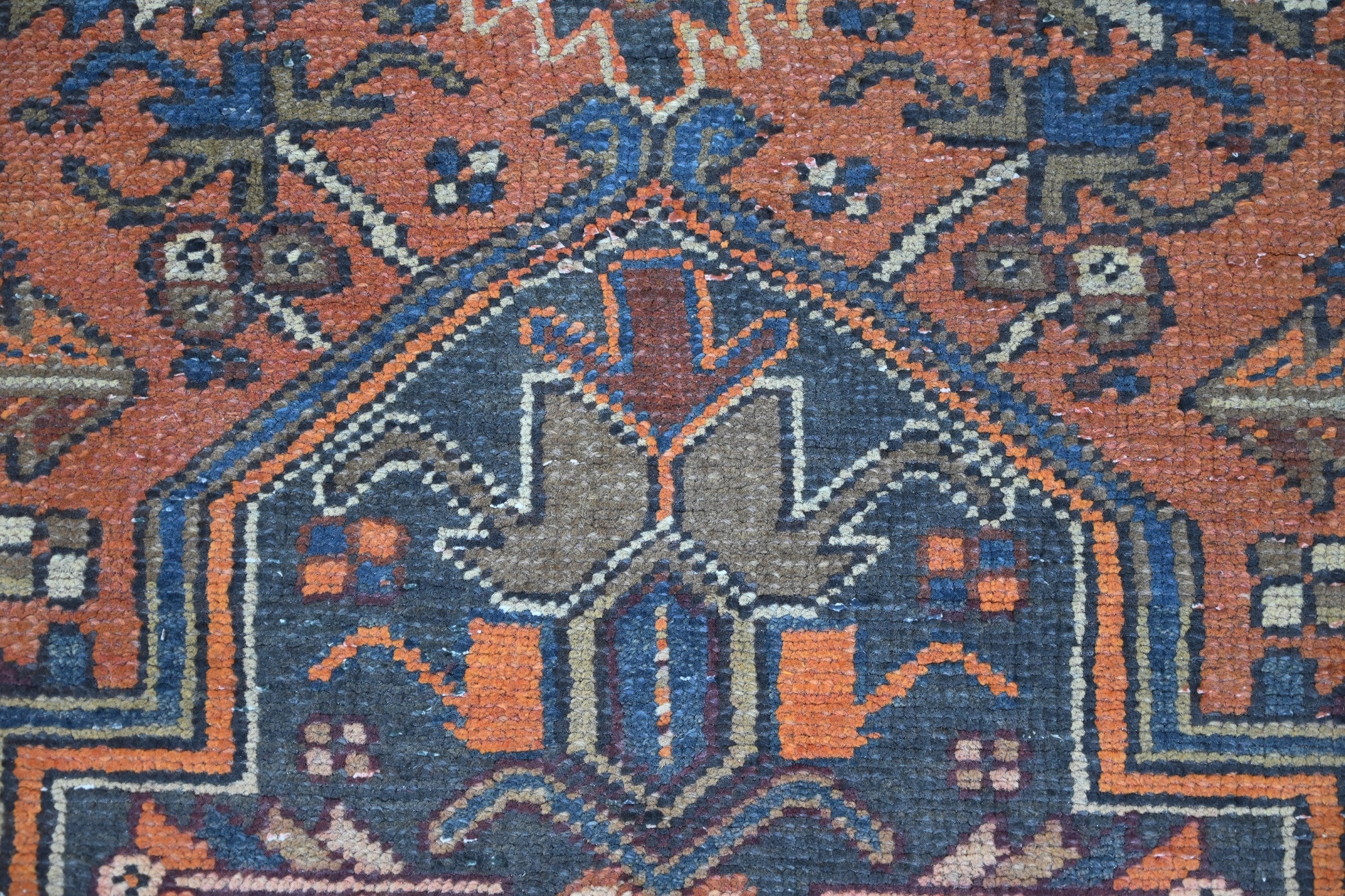 Persian Heriz area rug in rust and navy, view 15 of 21