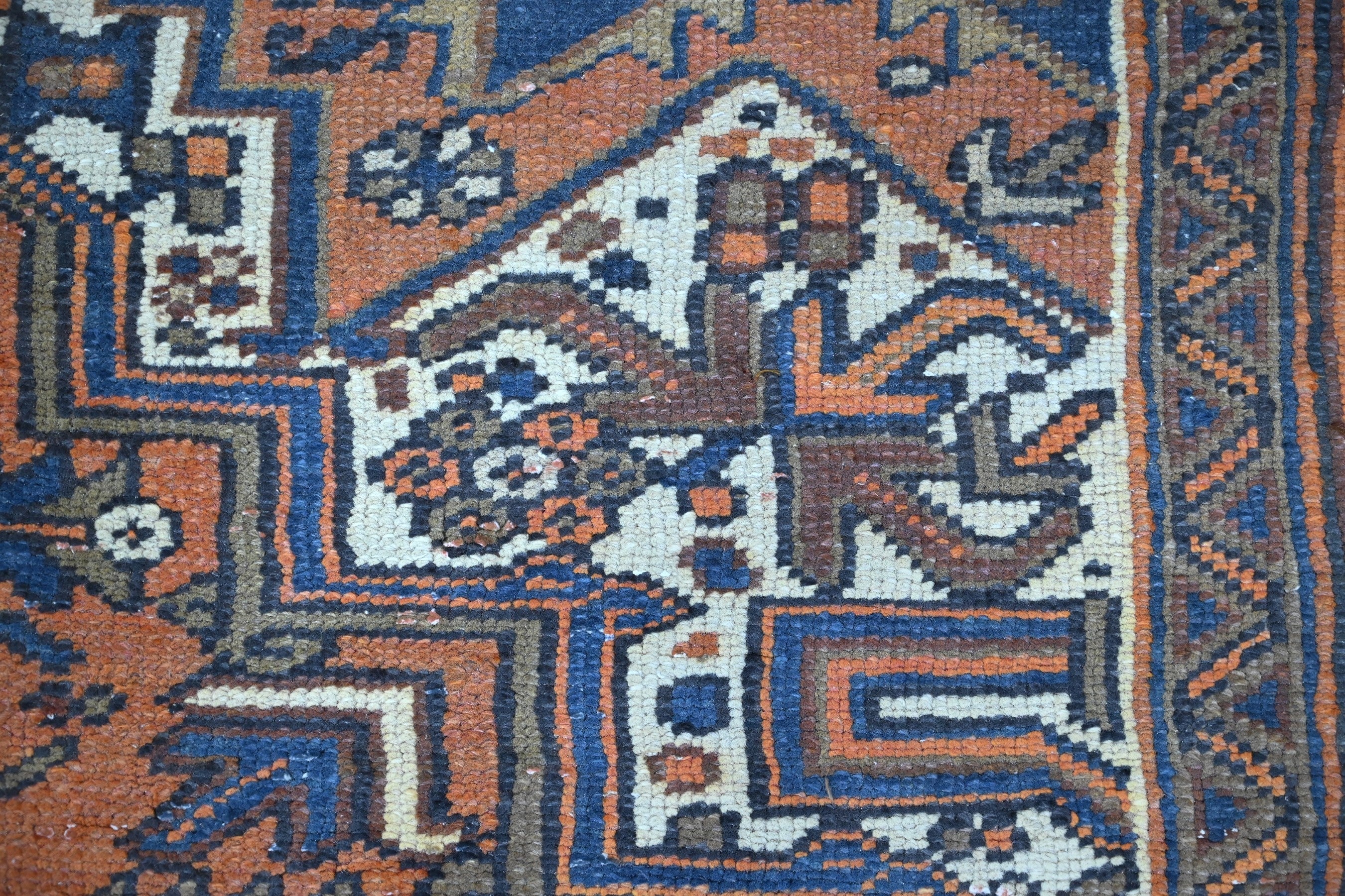 Persian Heriz area rug in rust and navy, view 16 of 21