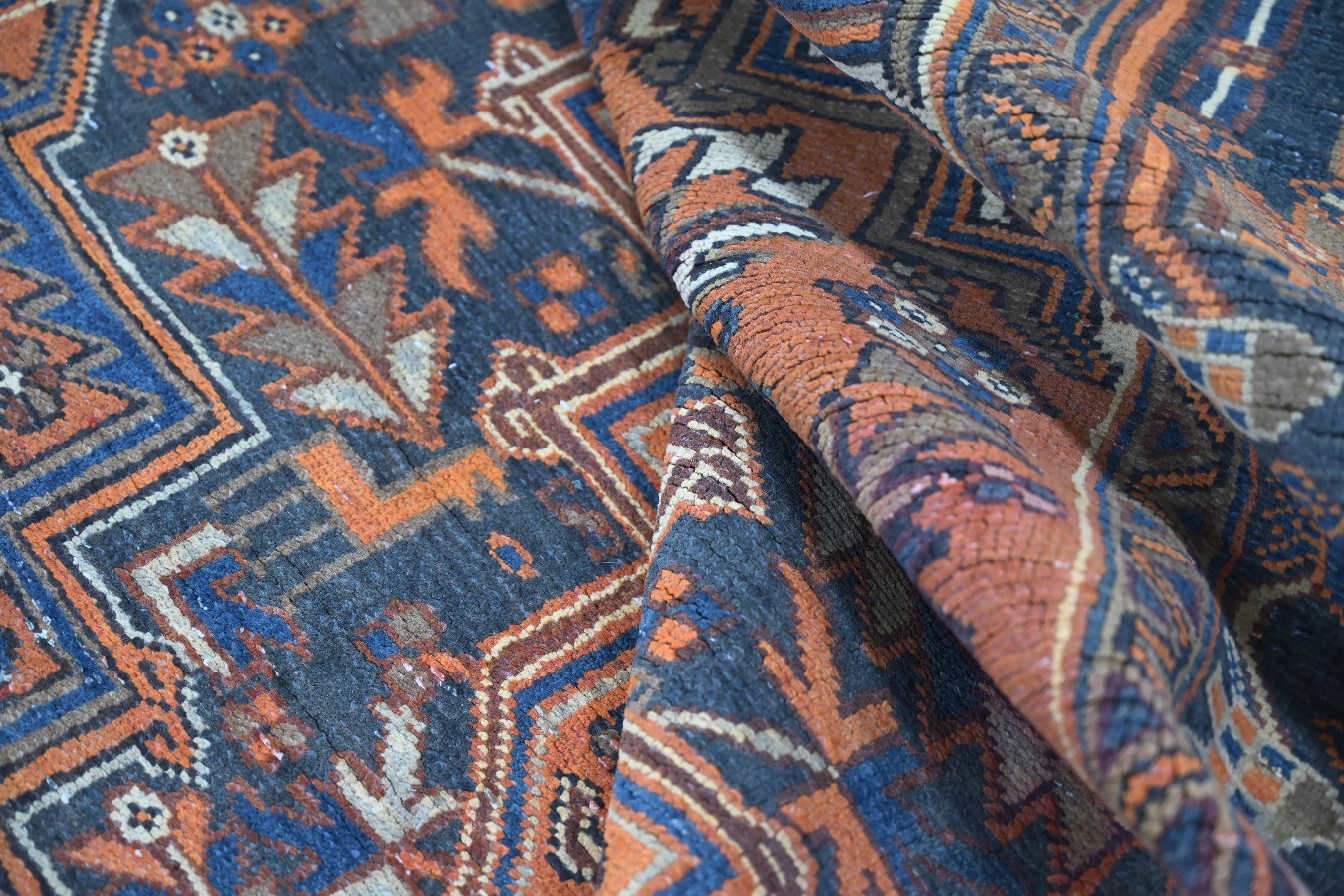 Persian Heriz area rug in rust and navy, view 17 of 21