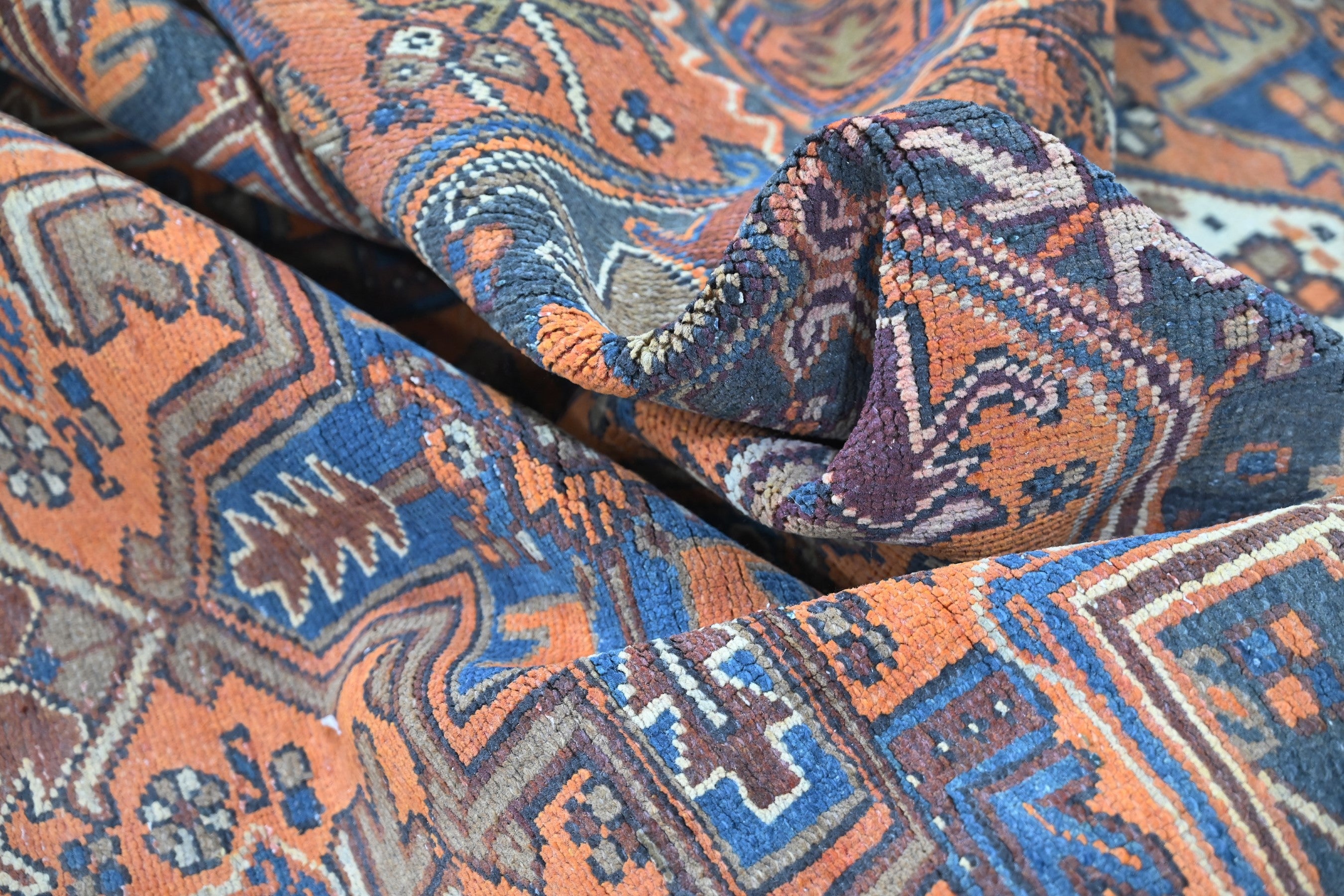 Persian Heriz area rug in rust and navy, view 19 of 21