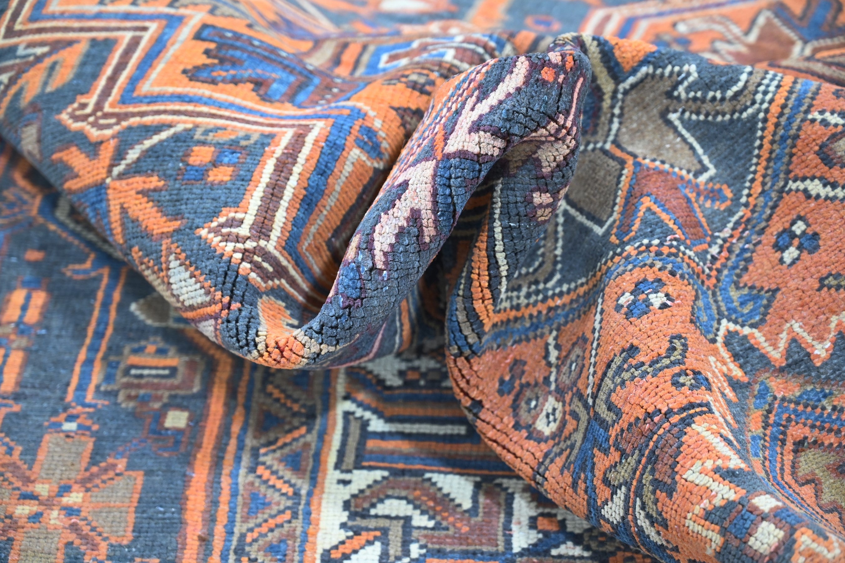 Persian Heriz area rug in rust and navy, view 20 of 21