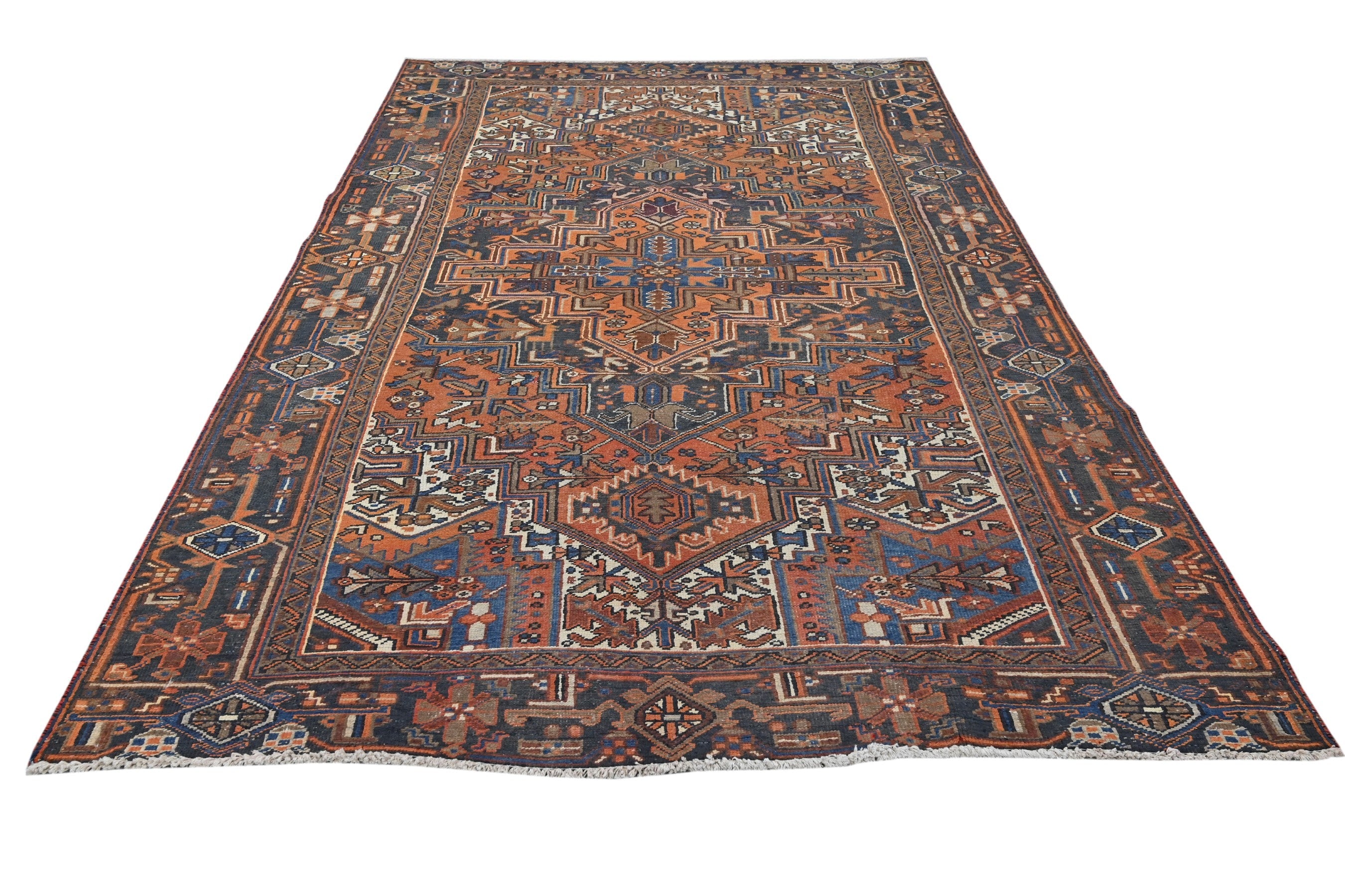 Persian Heriz area rug in rust and navy, view 2 of 21