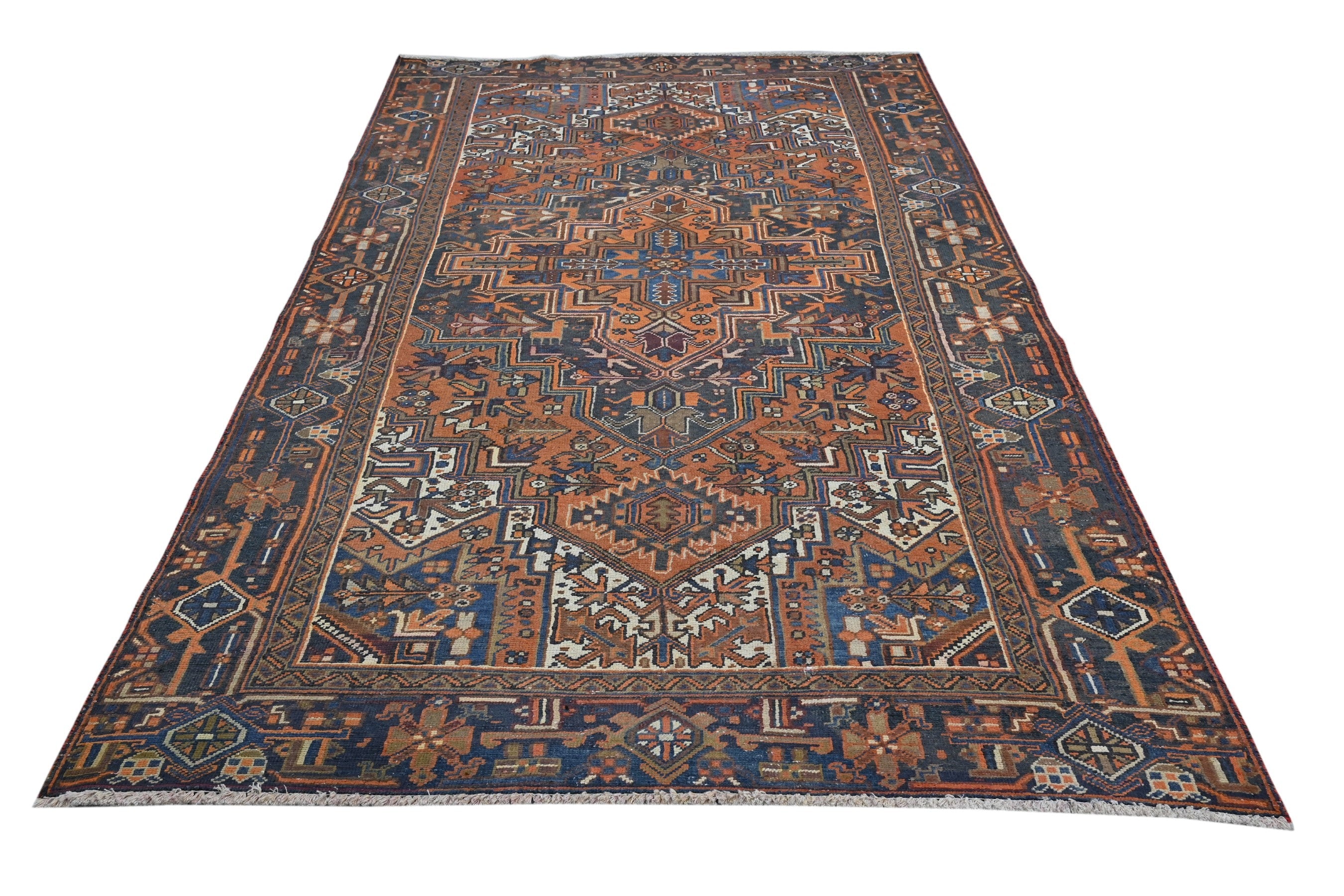 Persian Heriz area rug in rust and navy, view 3 of 21