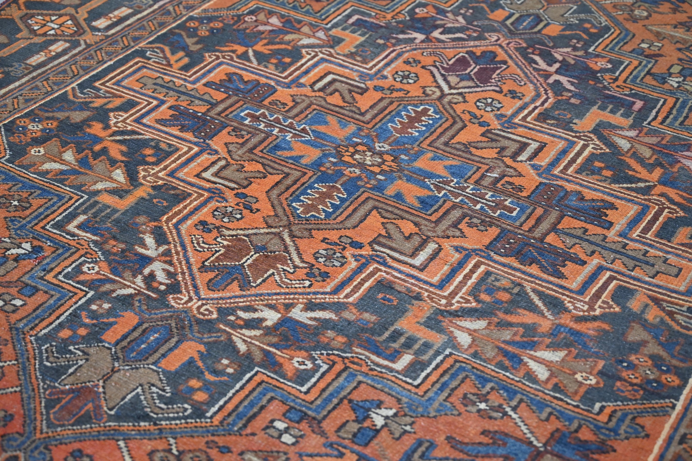 Persian Heriz area rug in rust and navy, view 4 of 21