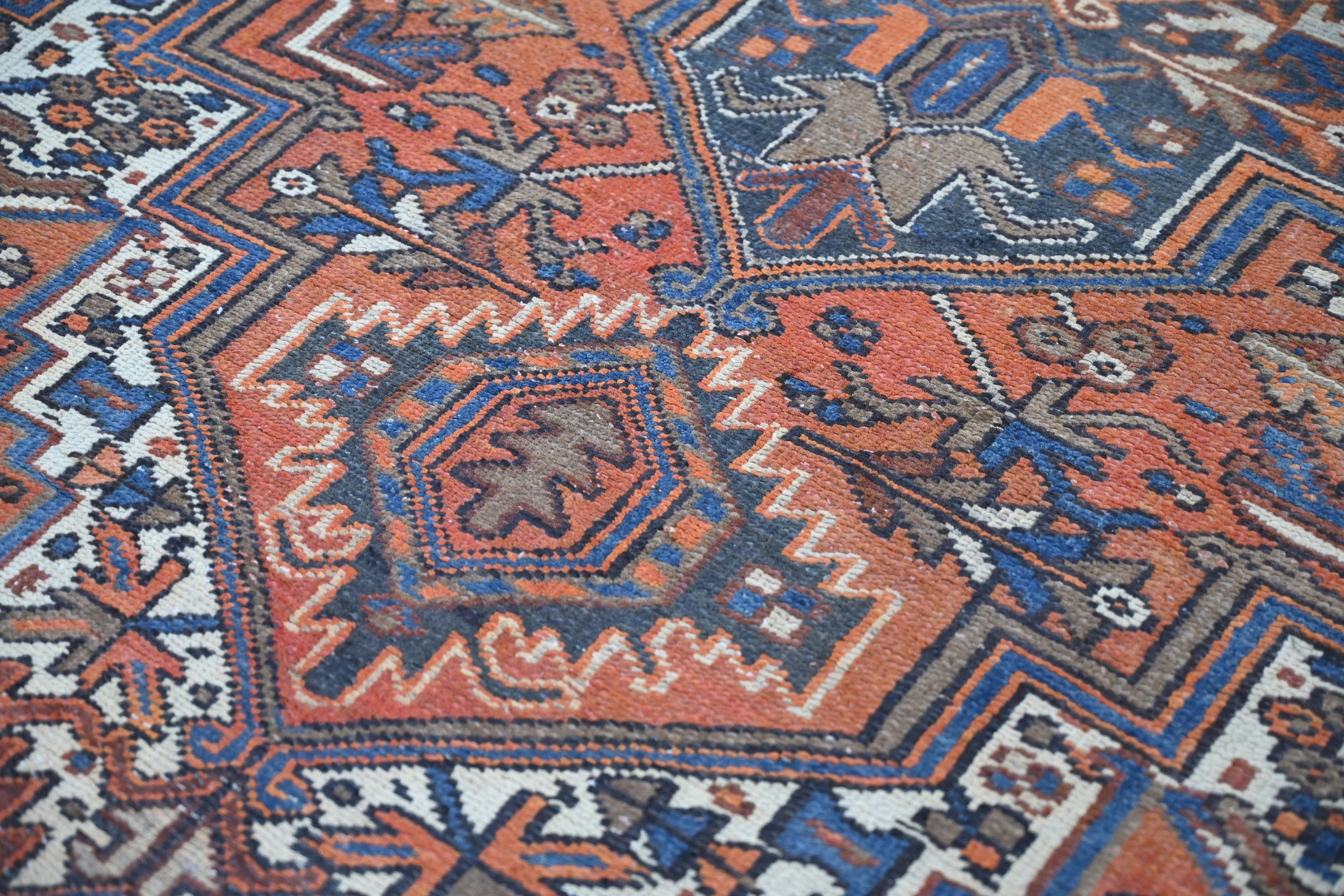 Persian Heriz area rug in rust and navy, view 5 of 21