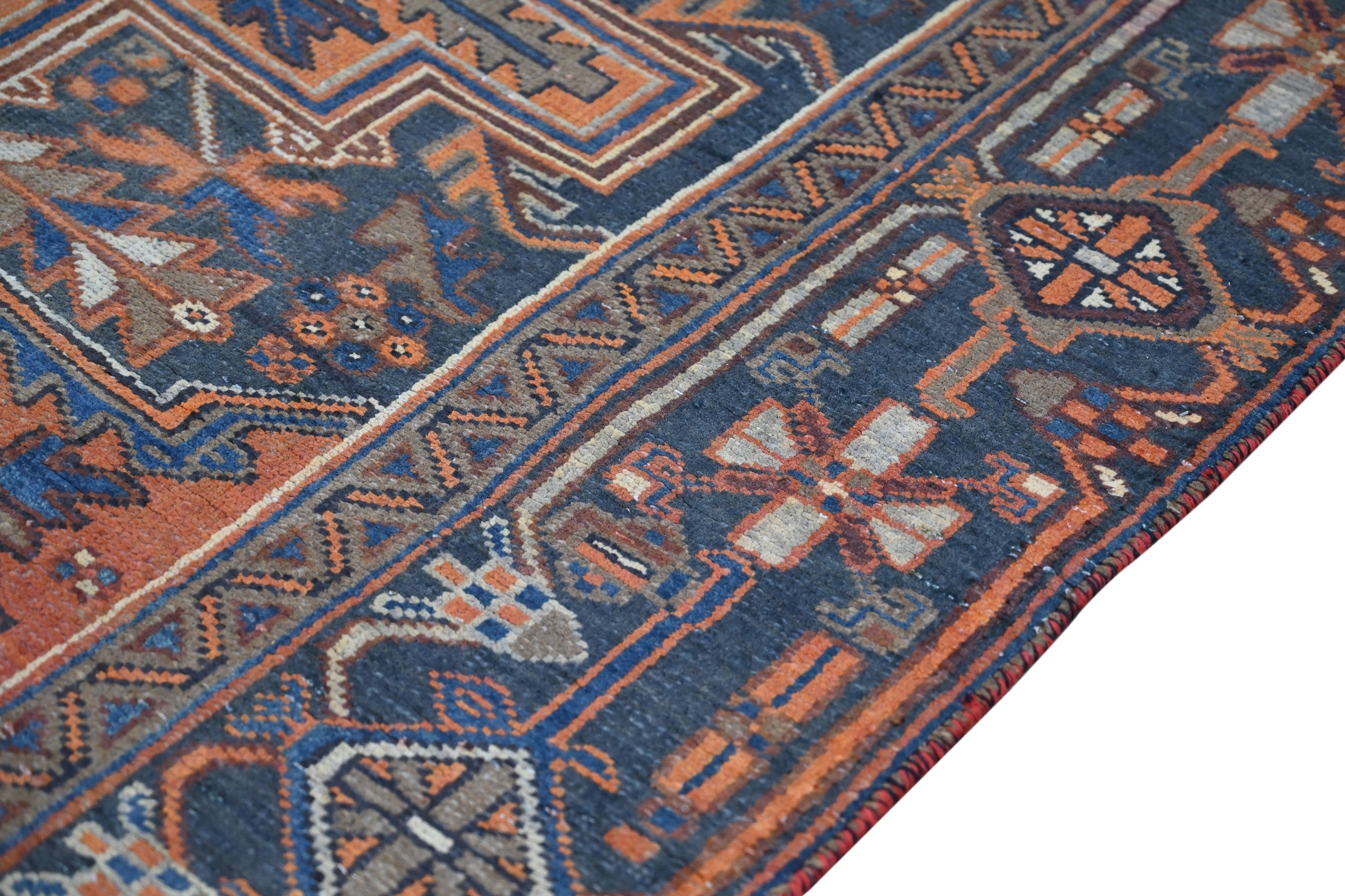 Persian Heriz area rug in rust and navy, view 6 of 21
