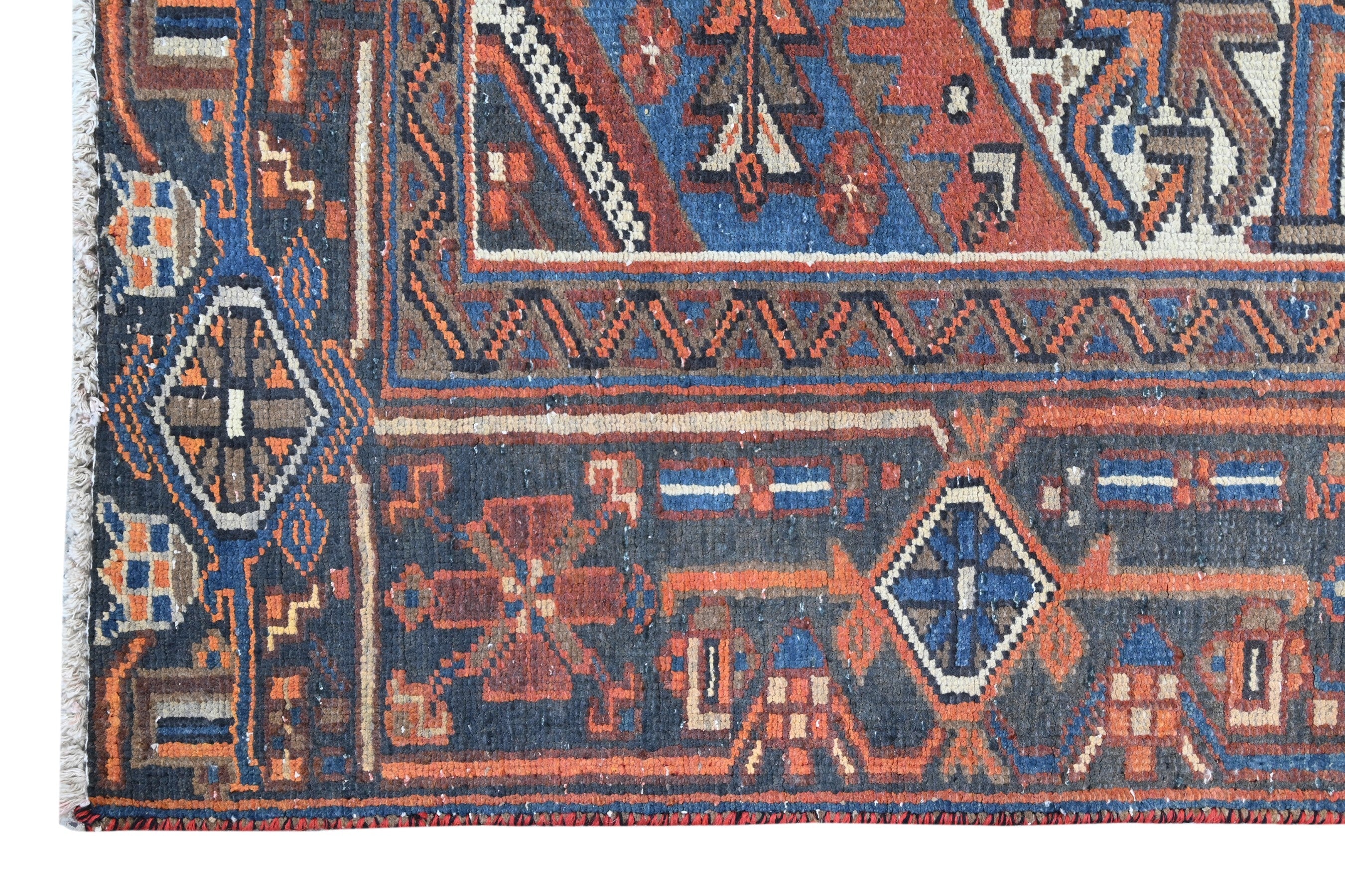 Persian Heriz area rug in rust and navy, view 8 of 21