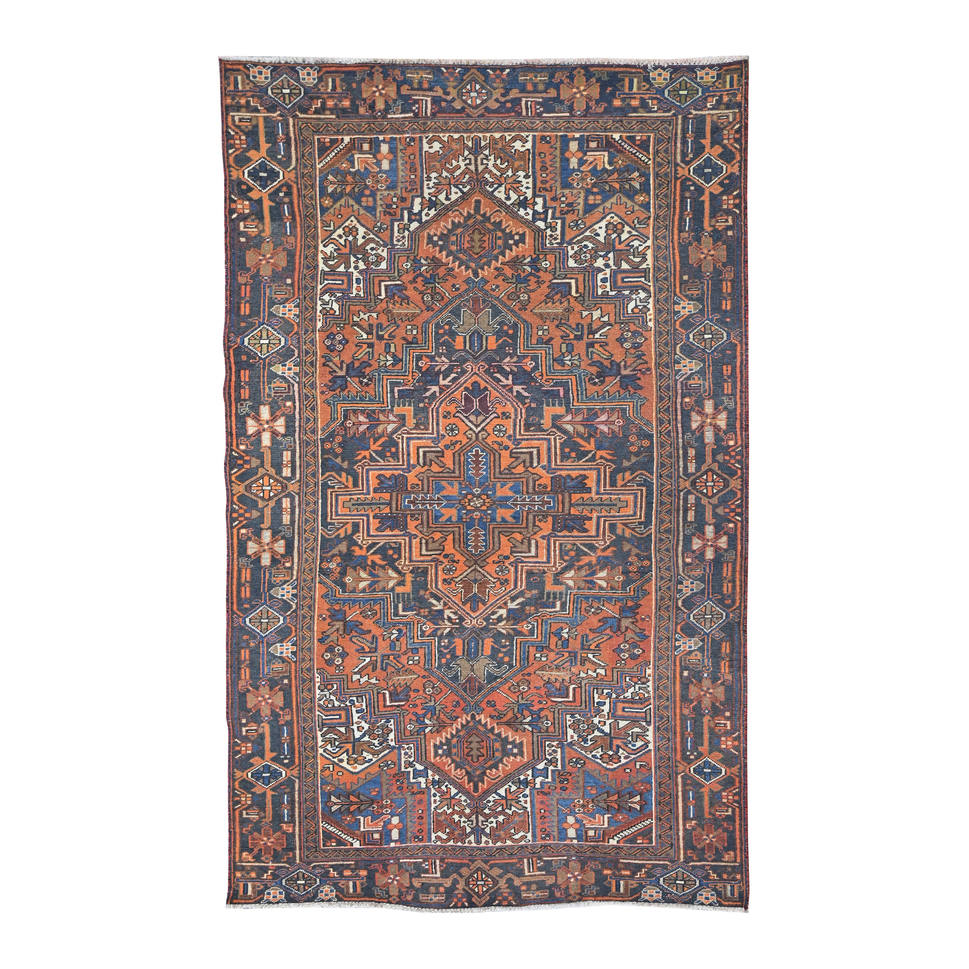 Persian Heriz area rug in rust and navy, 5'10" x 9'6"